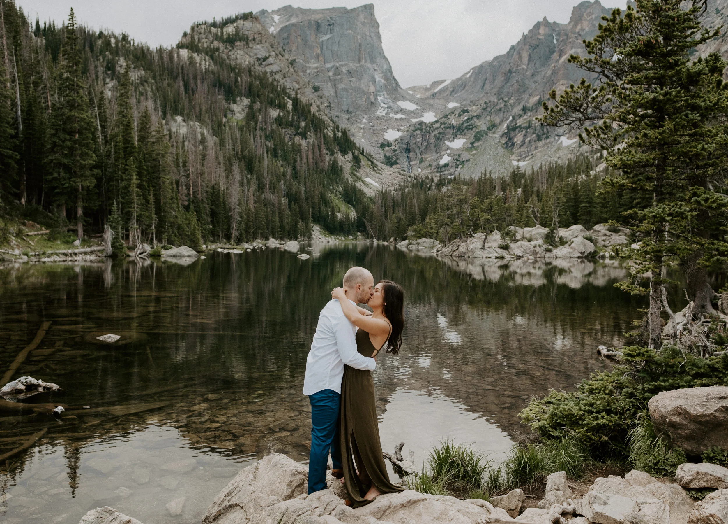  Adventure photographer. Dream Lake elopement. Estes Park, Colorado engagement session photographer. Sunset engagement photos at Dream Lake. Dream Lake in Rocky Mountain National Park adventure engagement photos. Colorado wedding and elopement photographer. 