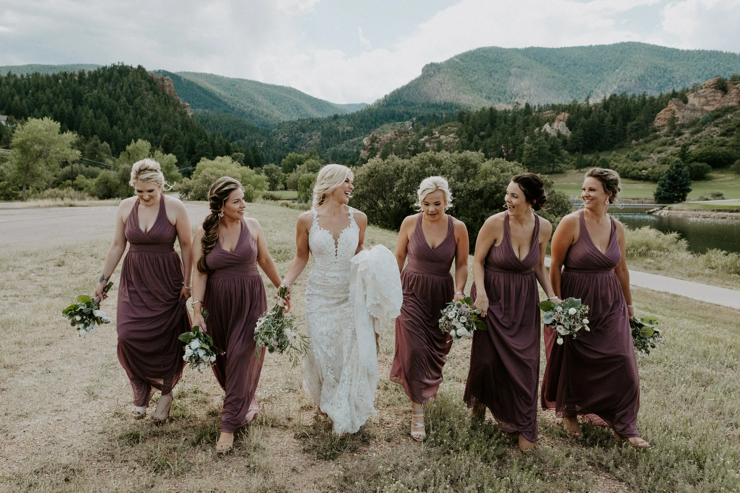  Perry Park Country Club wedding in Larkspur, Colorado. Bridesmaids photos at Perry Park Country Club. Bridesmaids dress ideas. Bridesmaids photos posing ideas. Wedding party ideas. Colorado wedding photographer. Colorado mountain elopement photographer. Colorado mountain wedding venue. Denver wedding photography. Bridesmaids bouquets. 