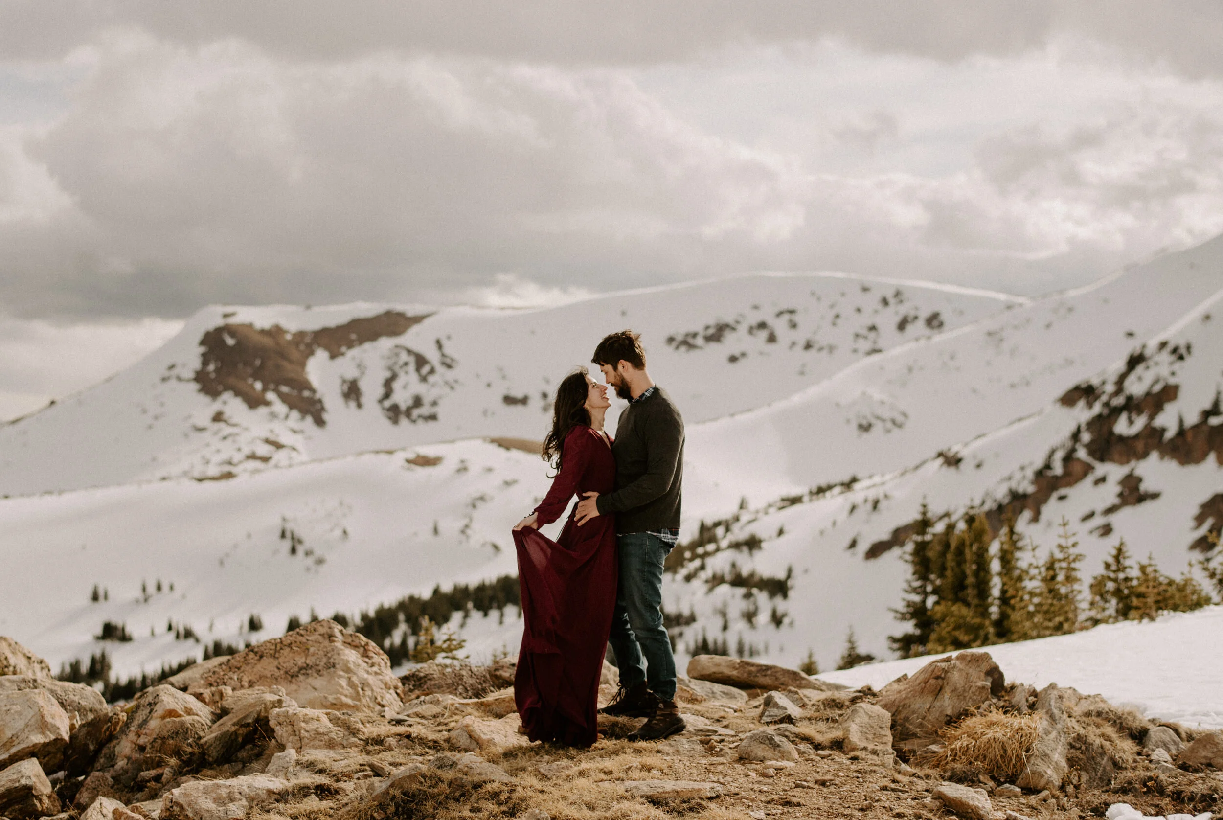  Winter Park, Colorado adventure engagement session. Winter Park wedding and elopement photographer. Colorado elopement photographer. Engagement session outfit ideas. Save the date inspiration. Snowy engagement photos.  