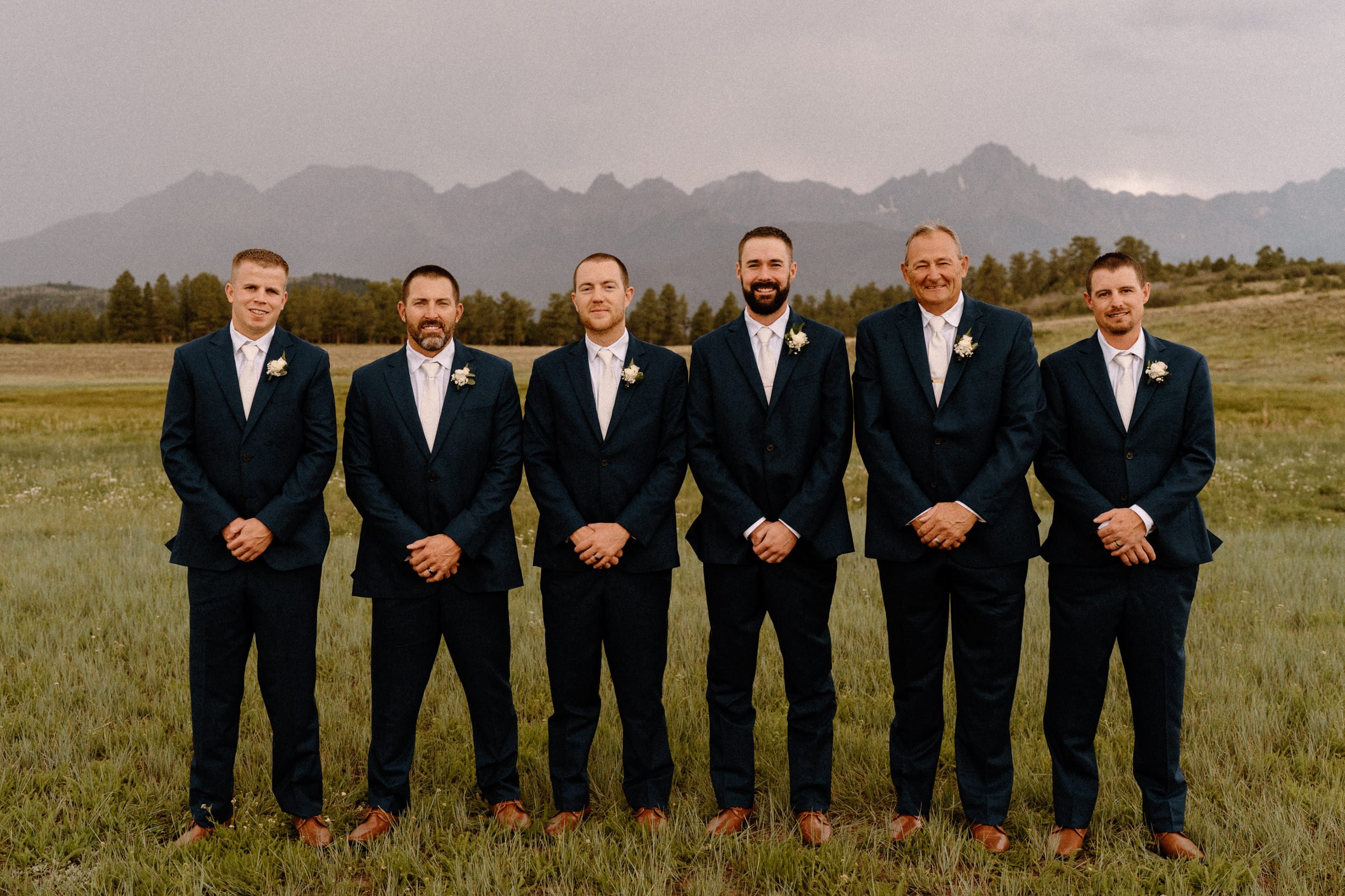 Groom poses with his groomsmen at Top of the Pines in Ridgway, CO