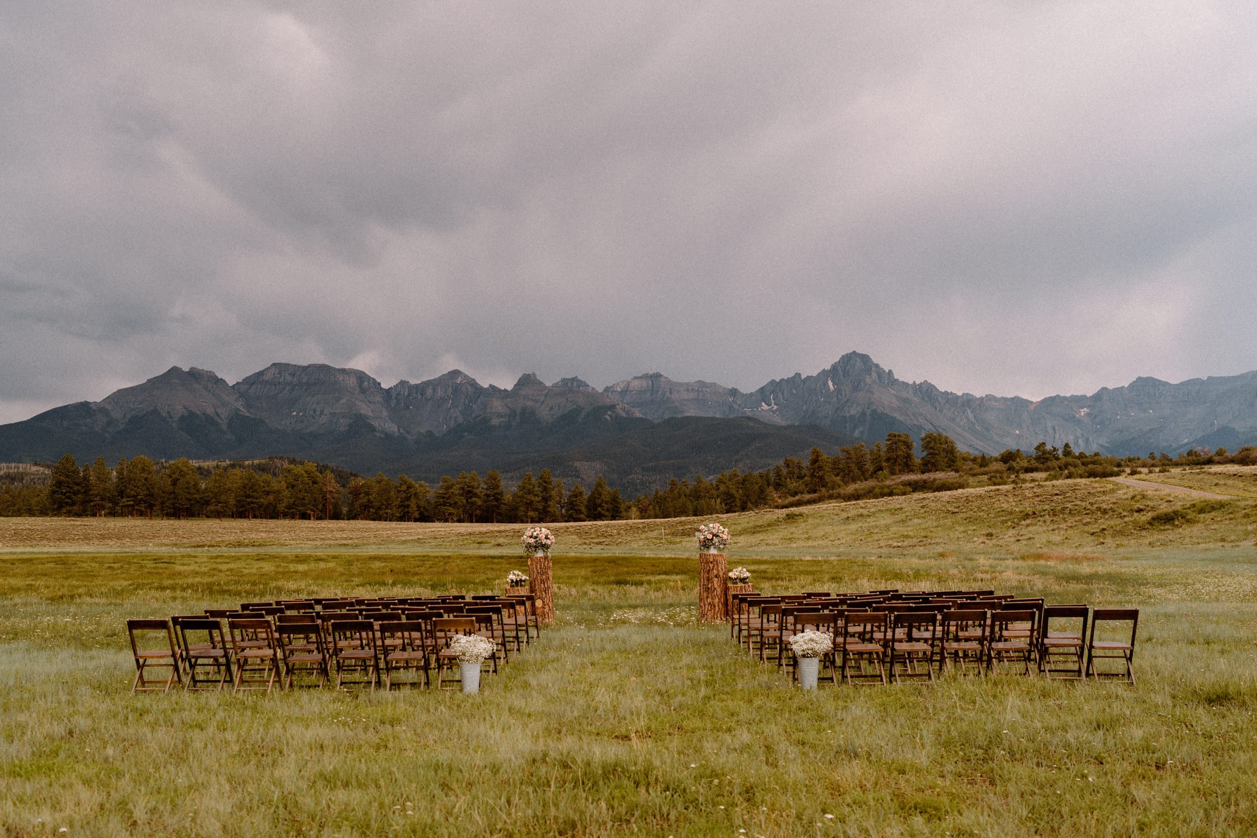 Chairs set up in a valley for the wedding ceremony at Top of the Pines in Ridgway, CO