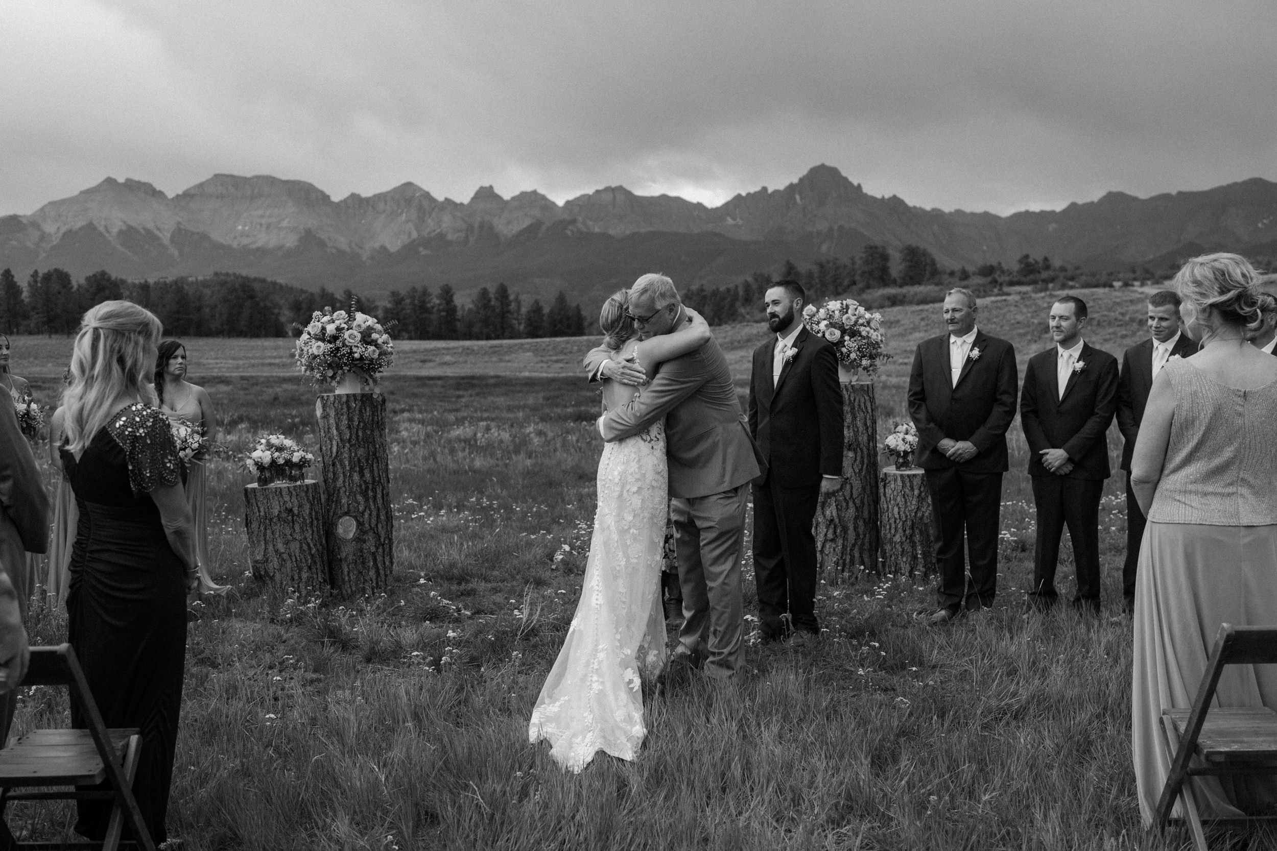 Bride and her father hug at the altar at Top of the Pines in Ridgway, CO