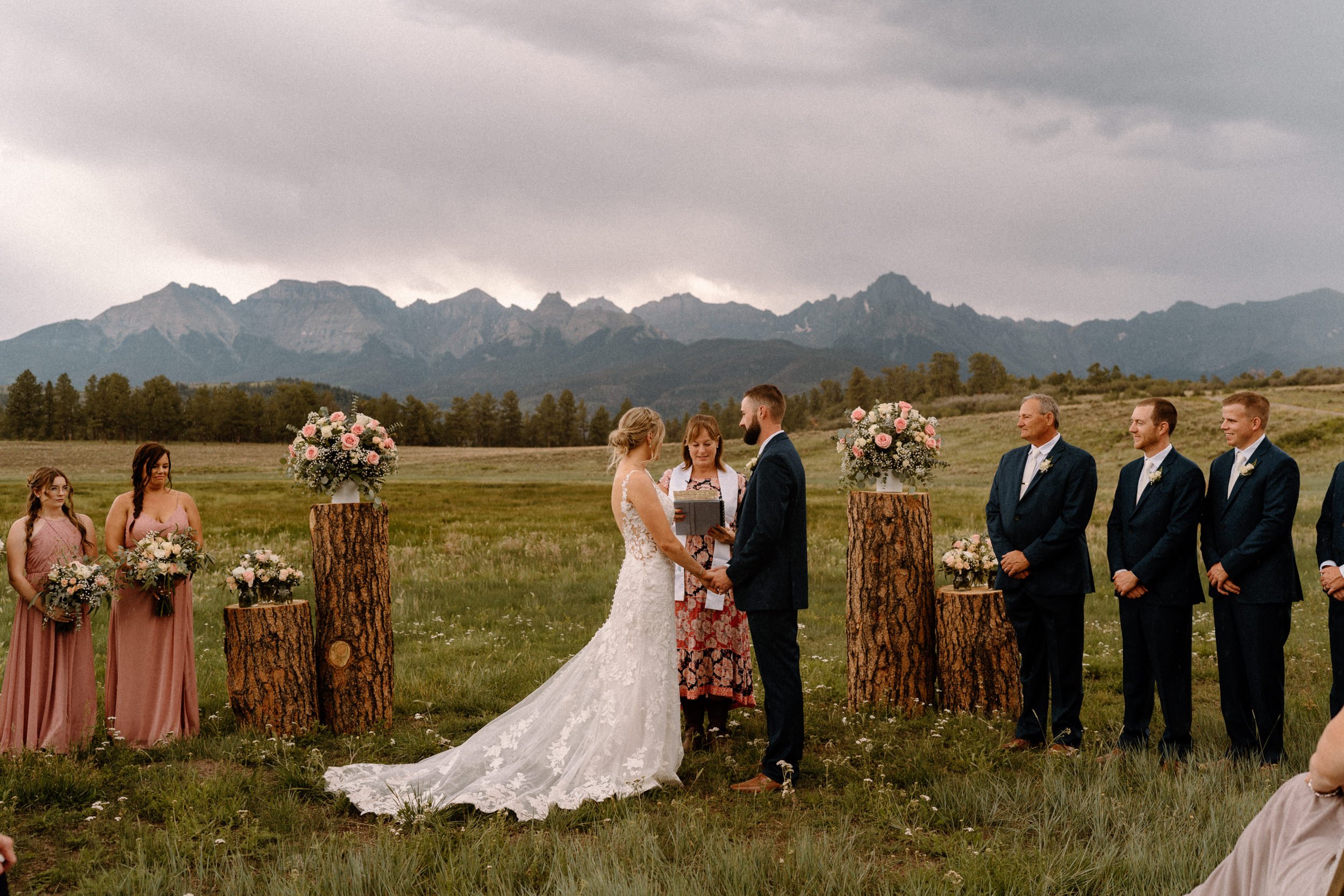 Bride and groom exchange vows at the altar at Top of the Pines in Ridgway, CO