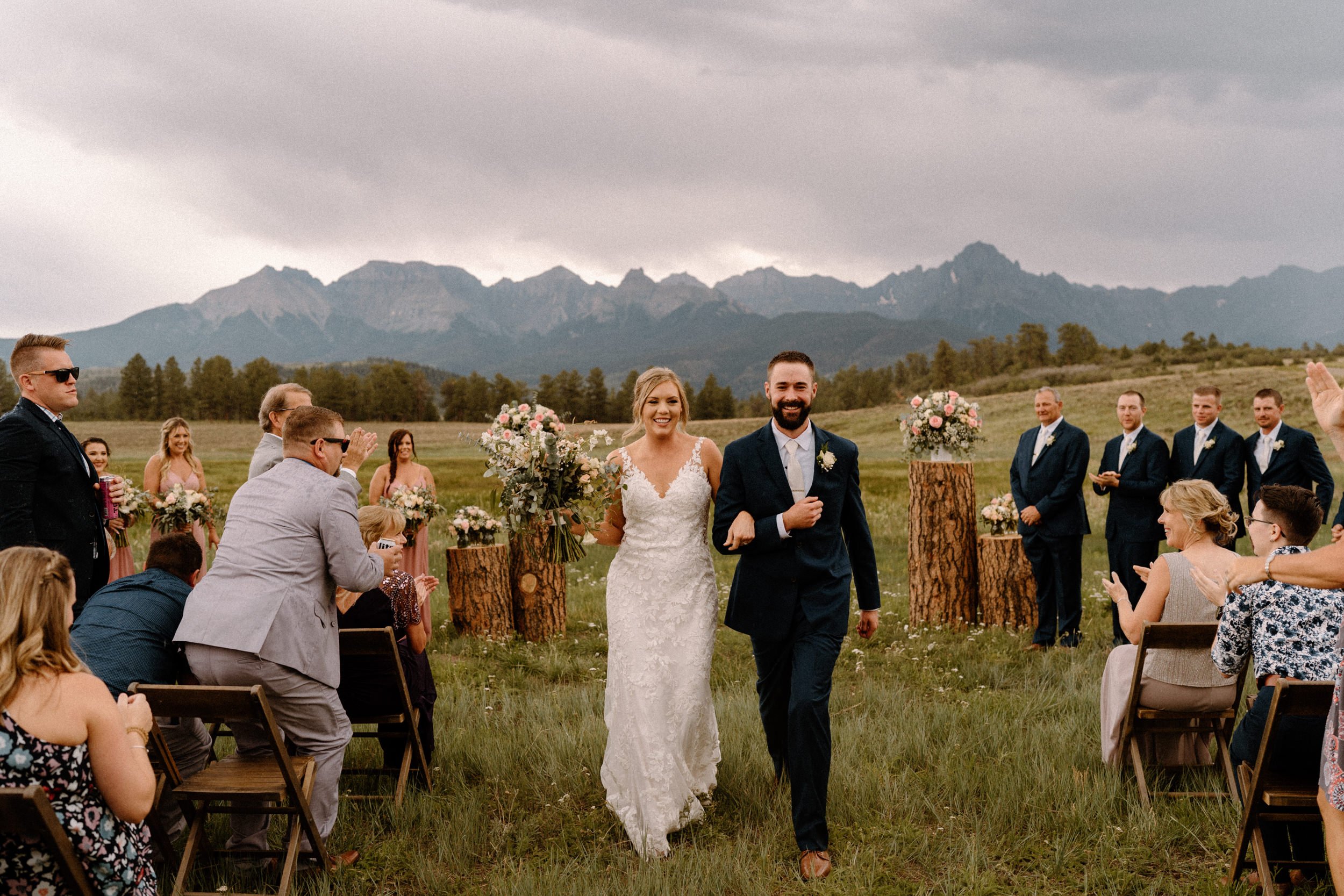 Bride and groom walk down the aisle together at Top of the Pines in Ridgway, CO