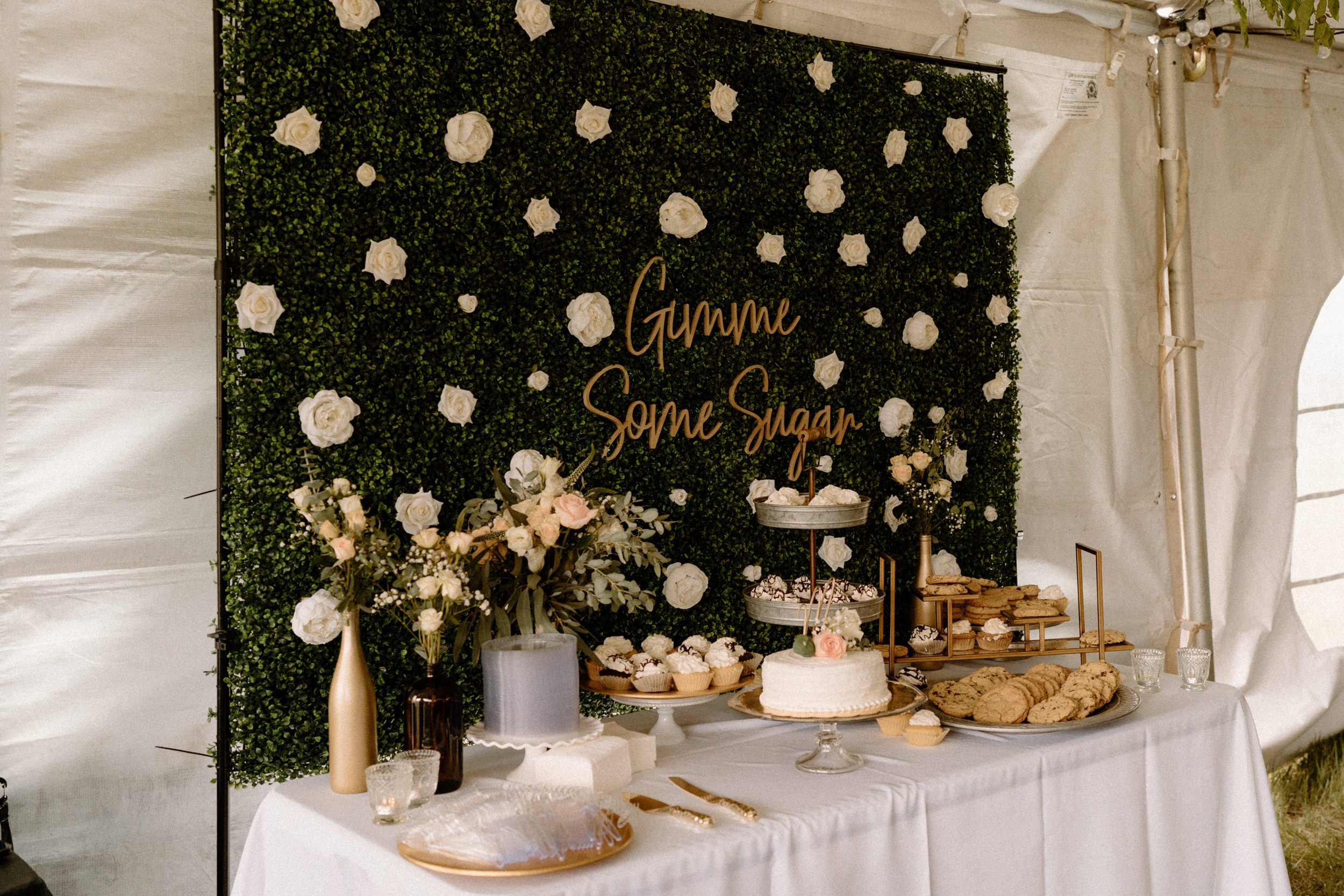 A dessert bar with a sign that reads "Gimme Some Sugar"