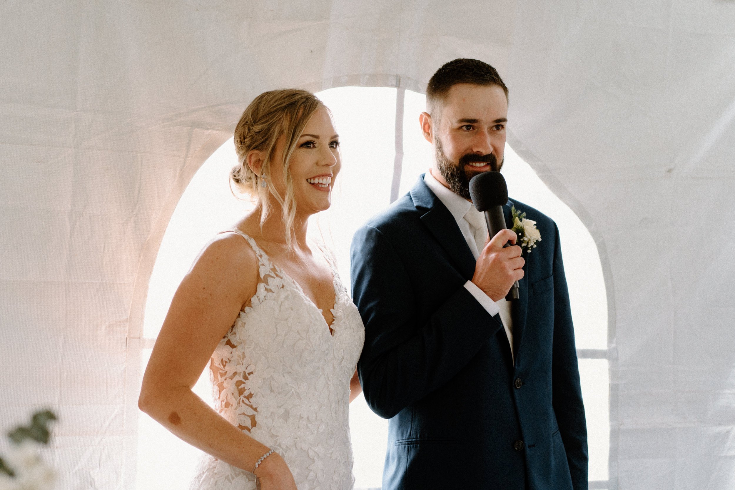 Bride and groom make a speech to their wedding guests