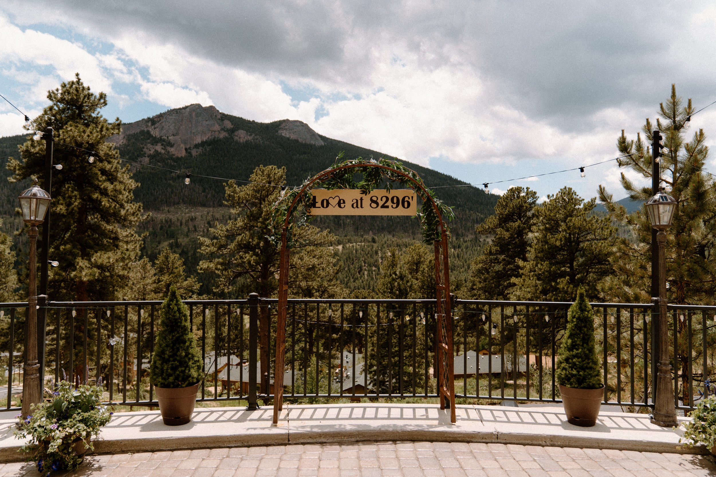 A sign reads "Love at 8296'" at the Della Terra Mountain Chateau in Estes Park, CO