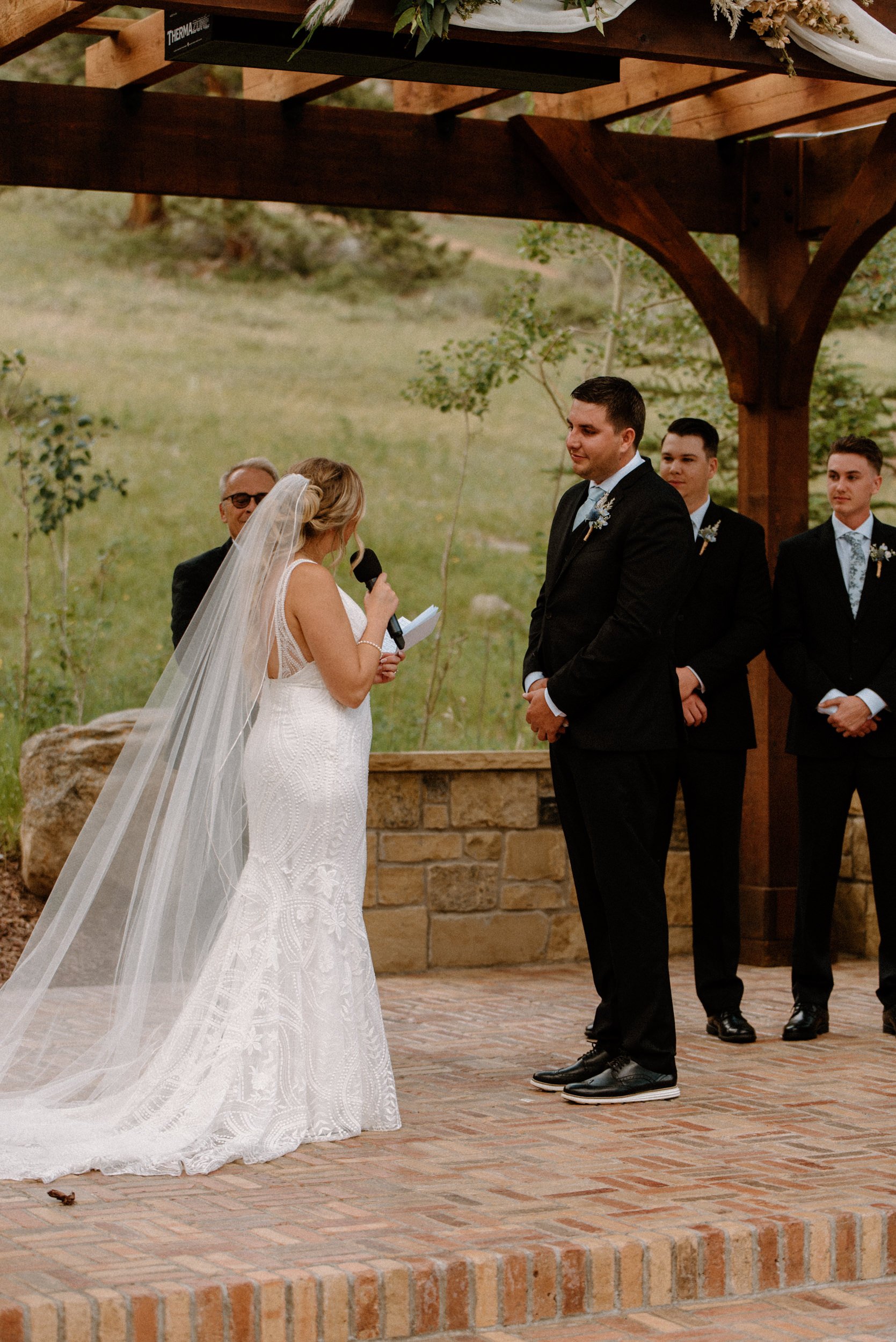 The bride reads her vows to the groom