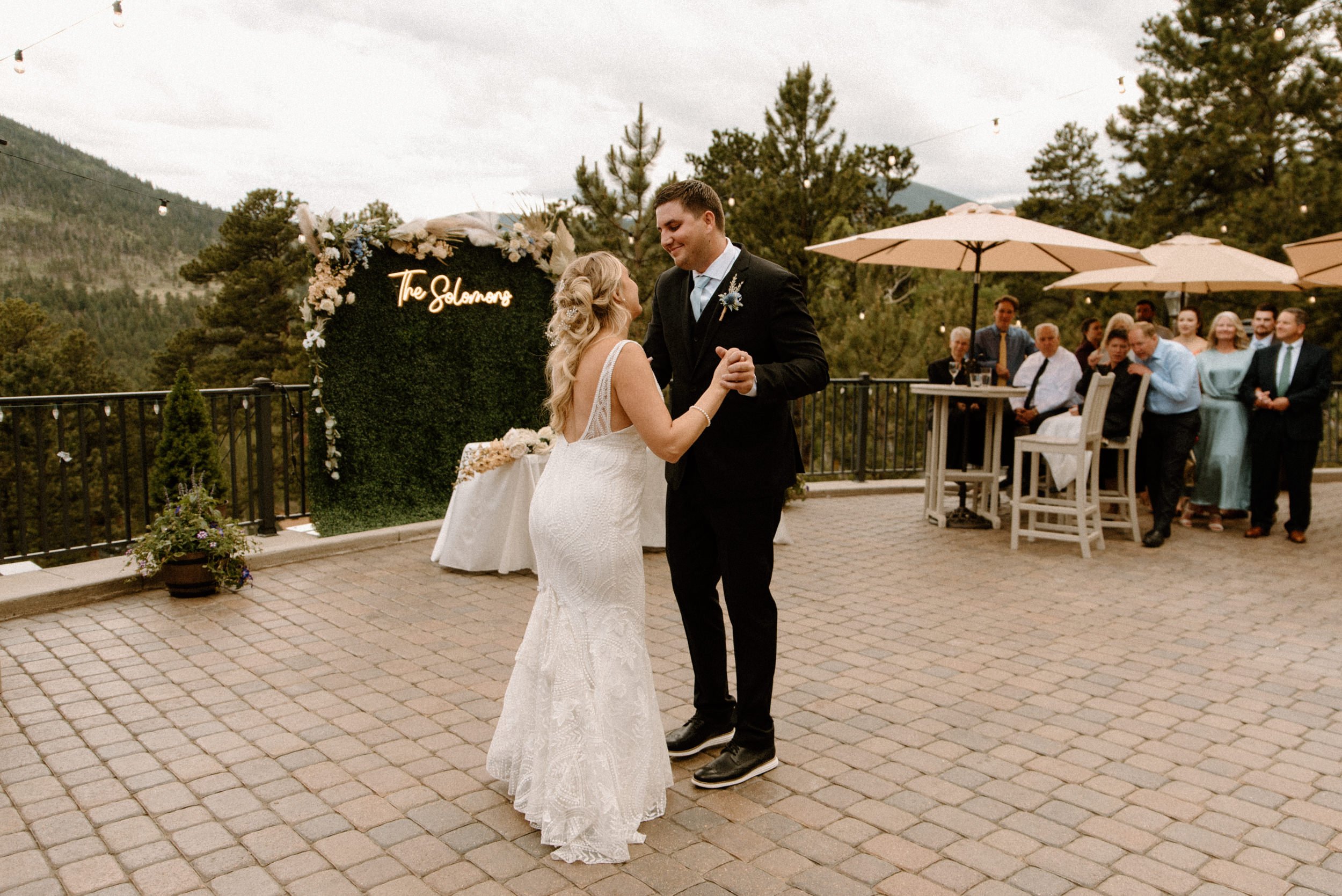 The bride and groom share their first dance outside of the Della Terra Mountain Chateau in Estes Park, CO