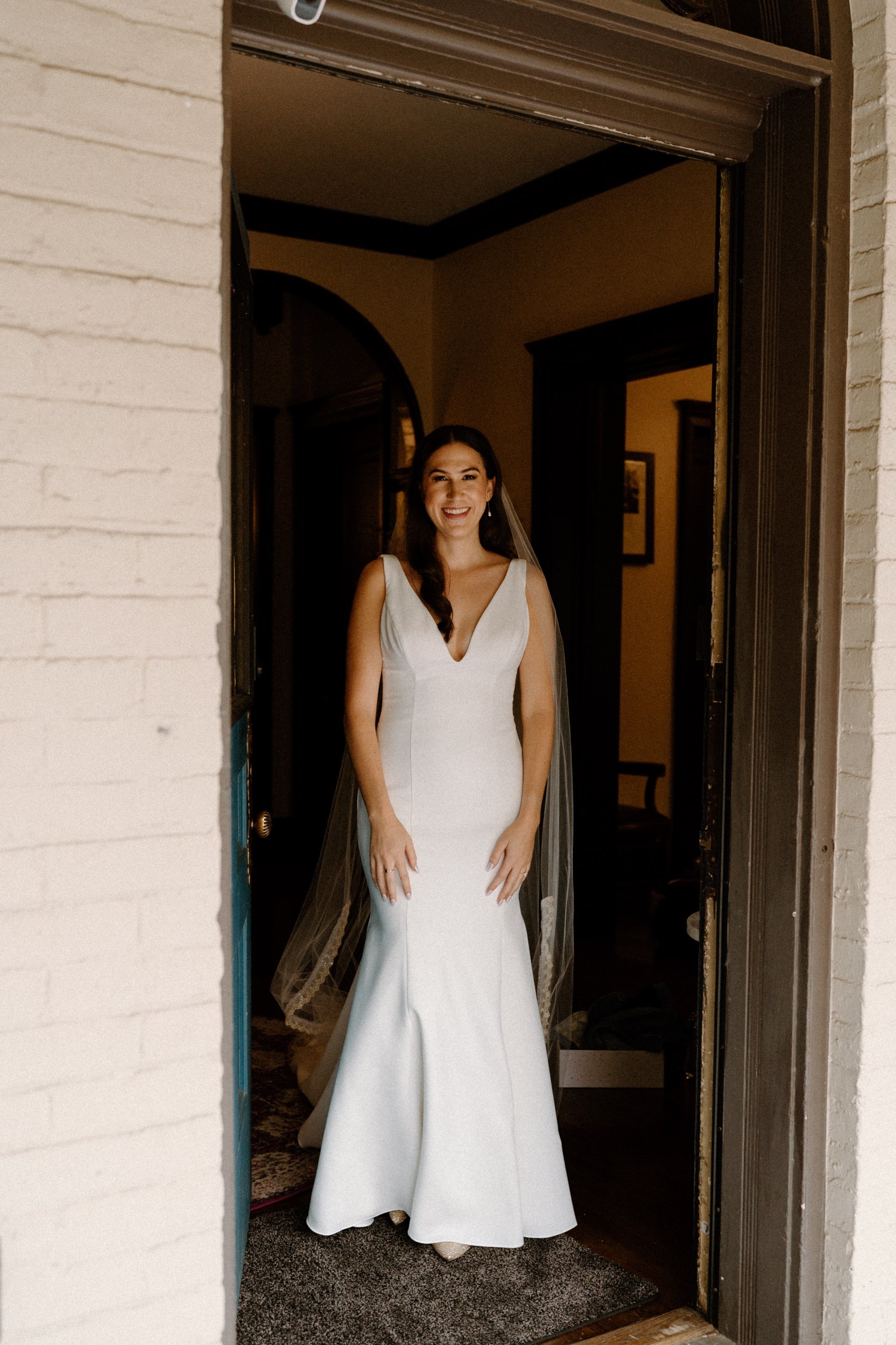 The bride walks out to her waiting bridal party
