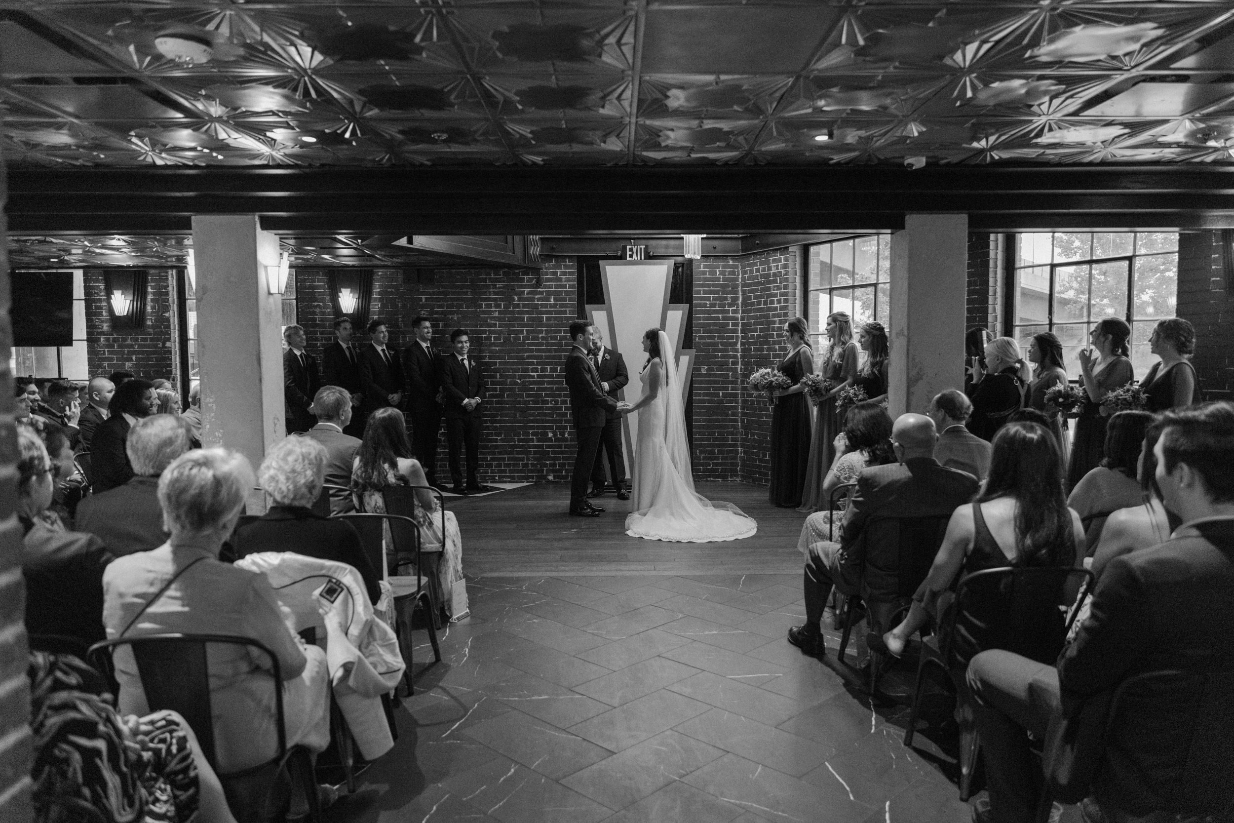 Guests watch the ceremony at Ironworks in Denver, CO