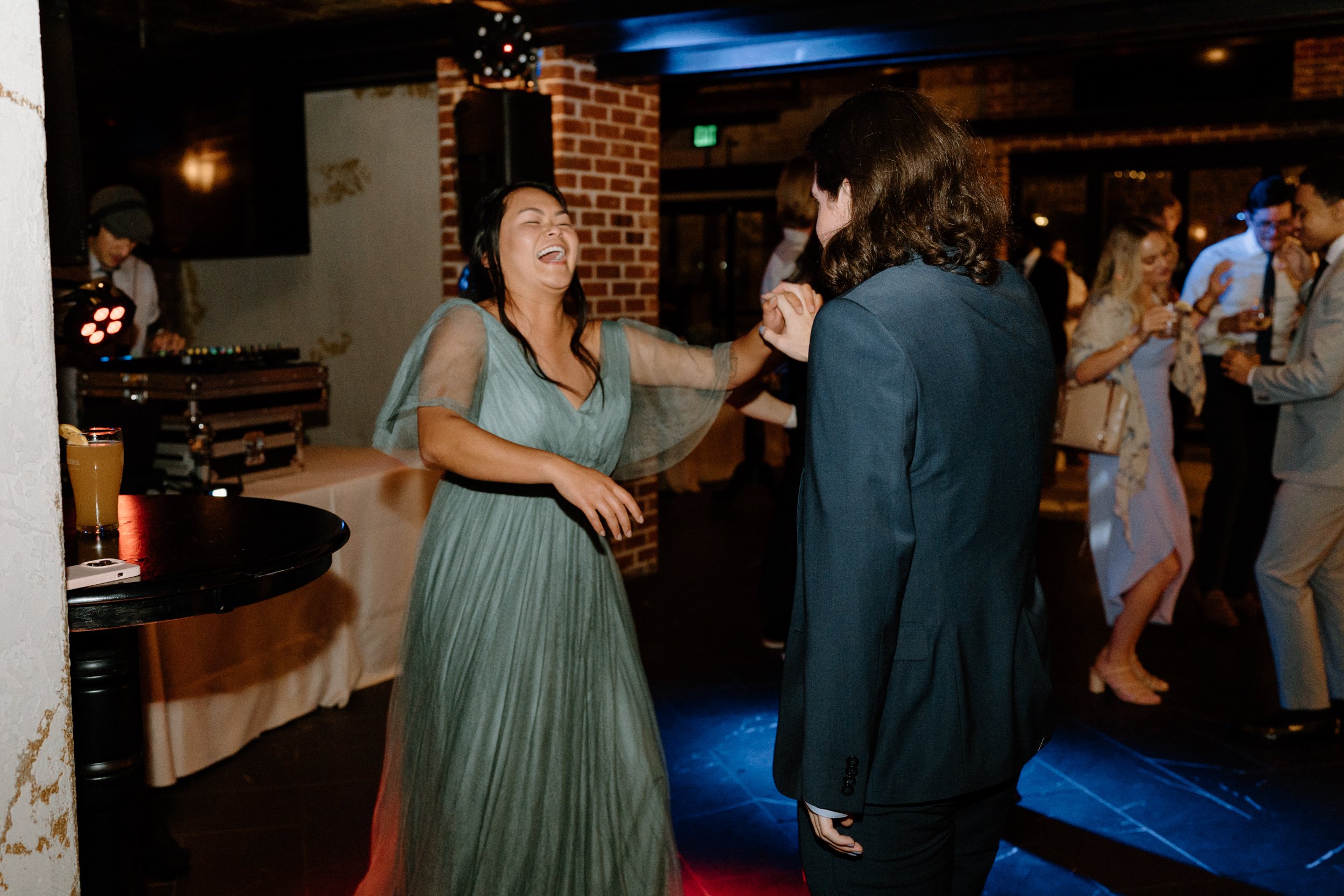Wedding guests dance during the reception
