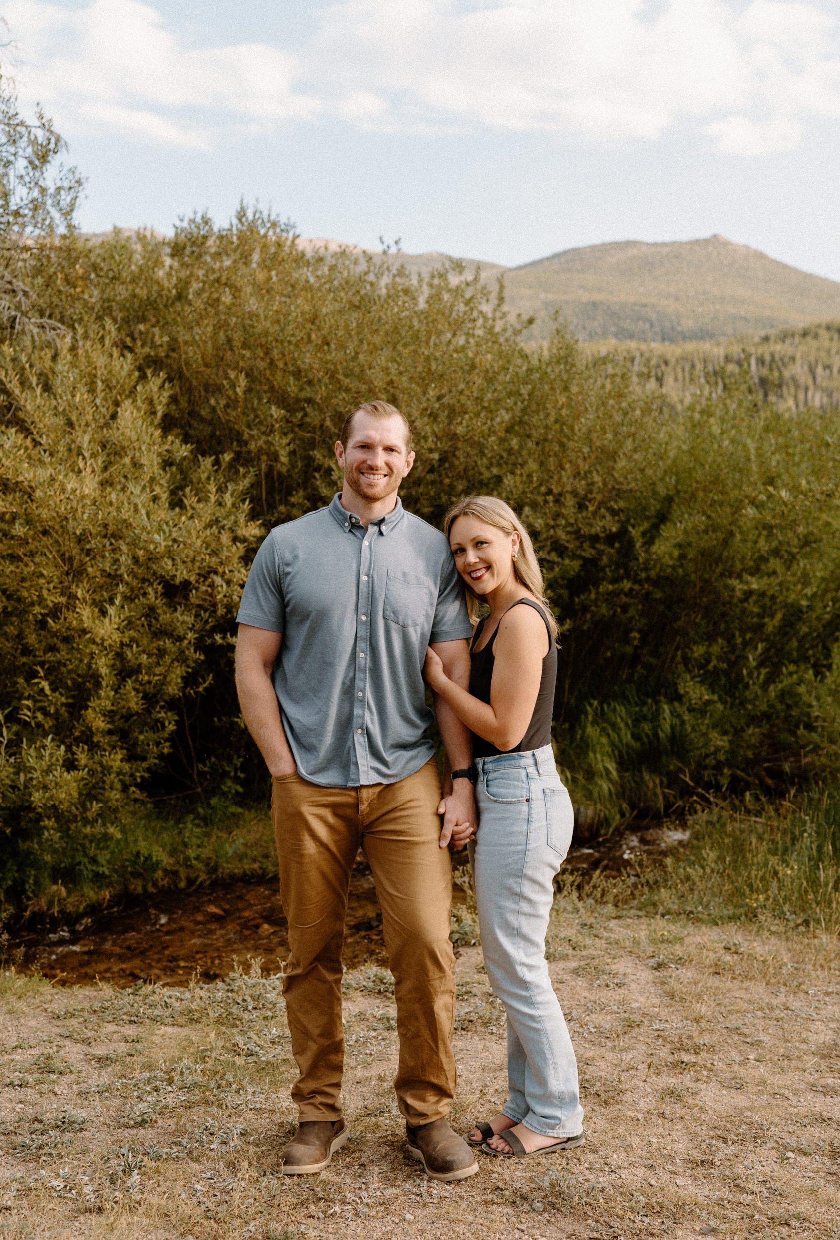 Man and woman pose during Rocky Mountain National Park engagement session