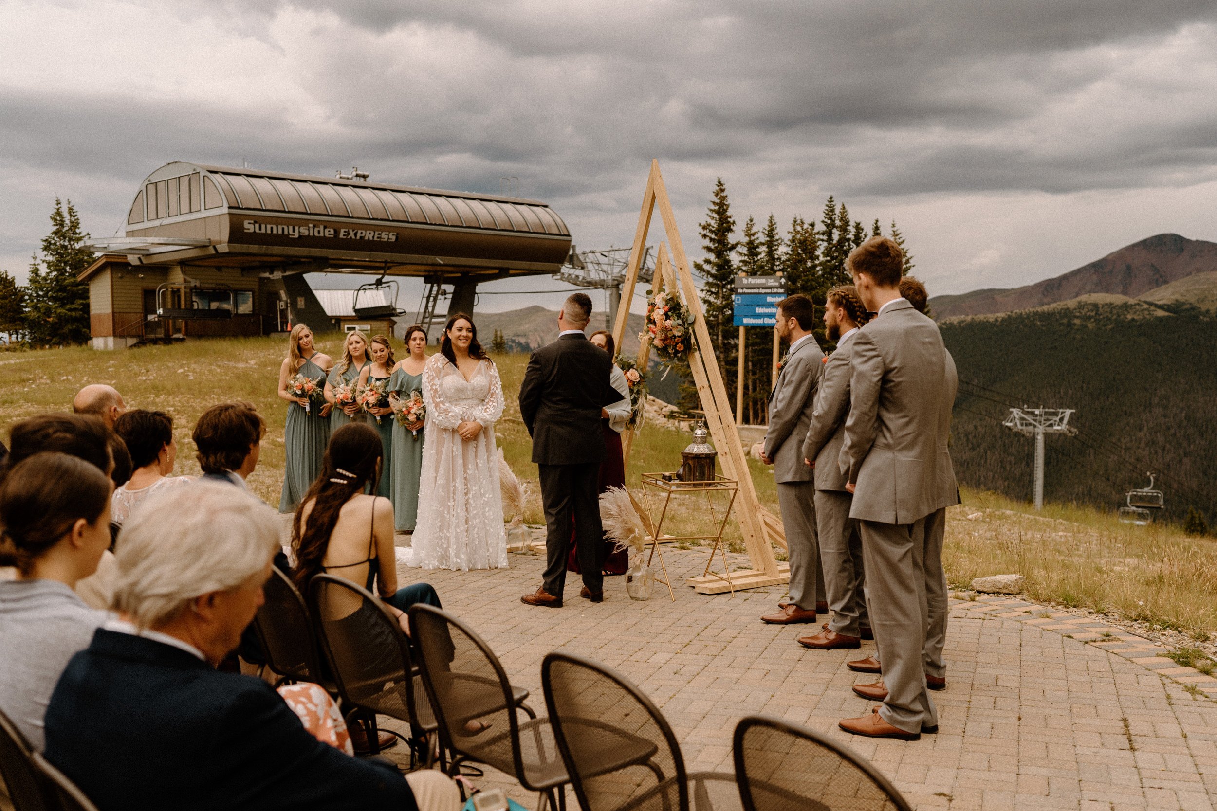 Bride and groom stand at the altar together at Lunch Rock in Winter Park, CO