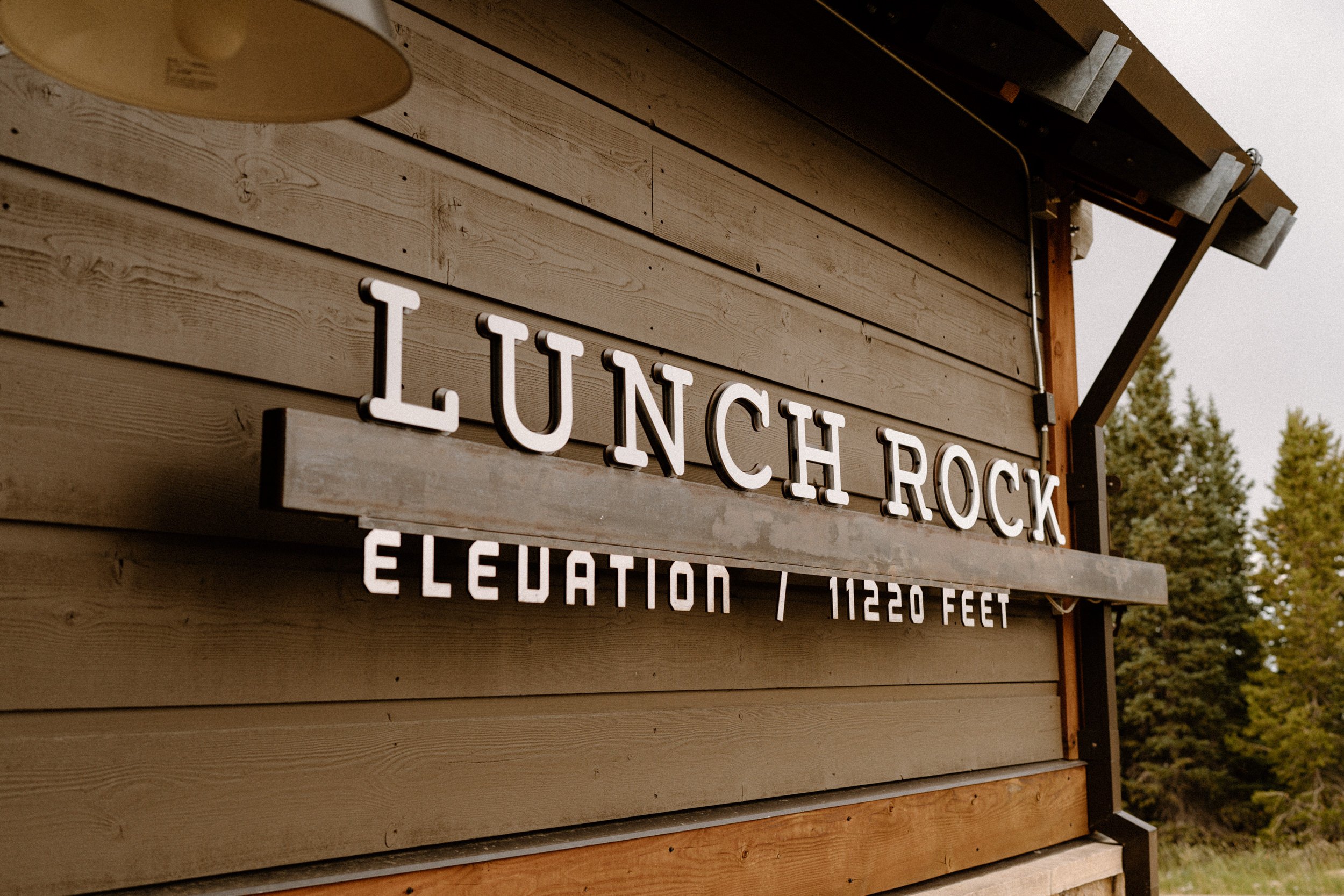 A sign that reads "Lunch Rock Elevation 11,200"