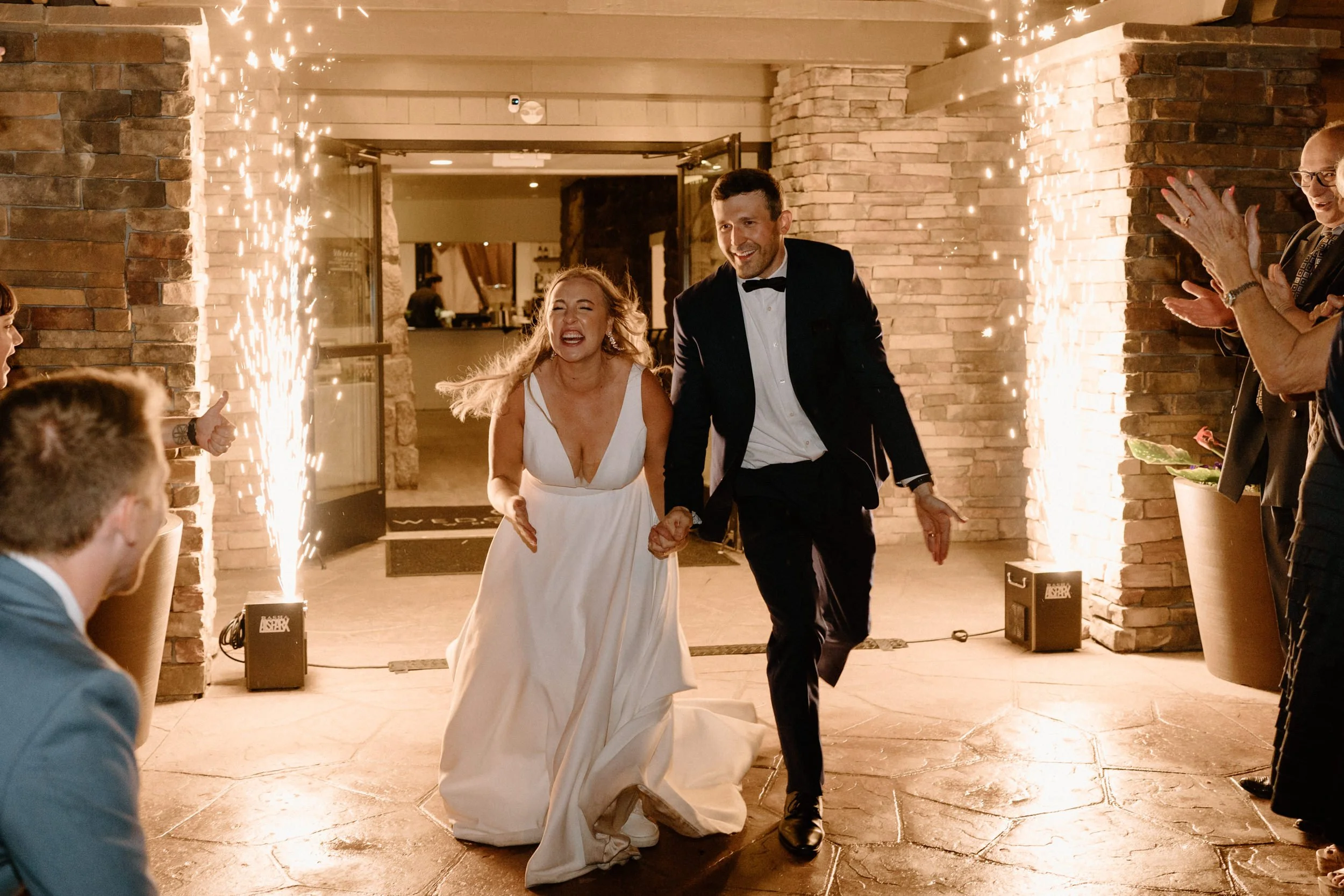 The bride and groom smile as they make their grand exit together