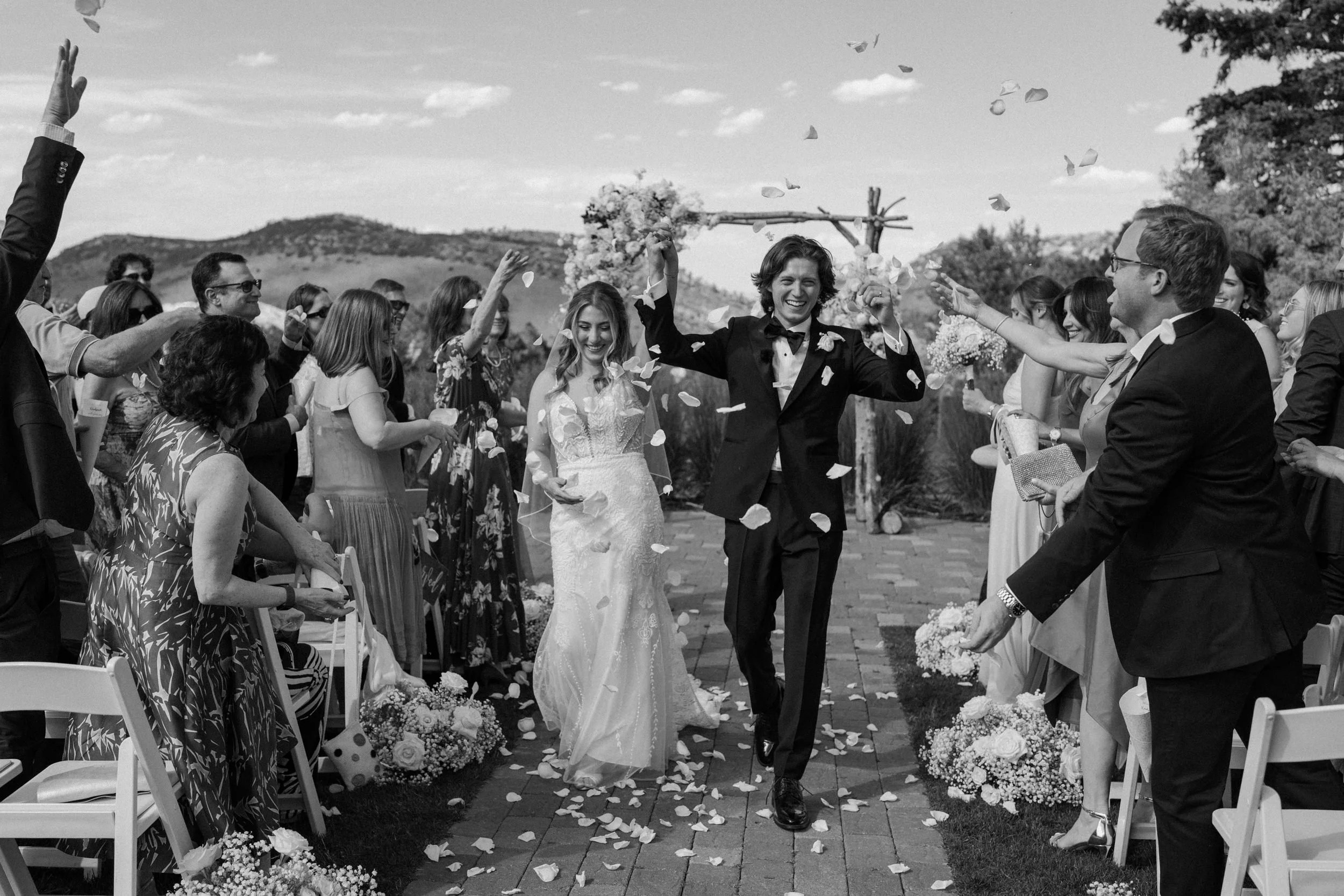 Bride and groom walking down the aisle after ceremony on wedding day at The Manor House