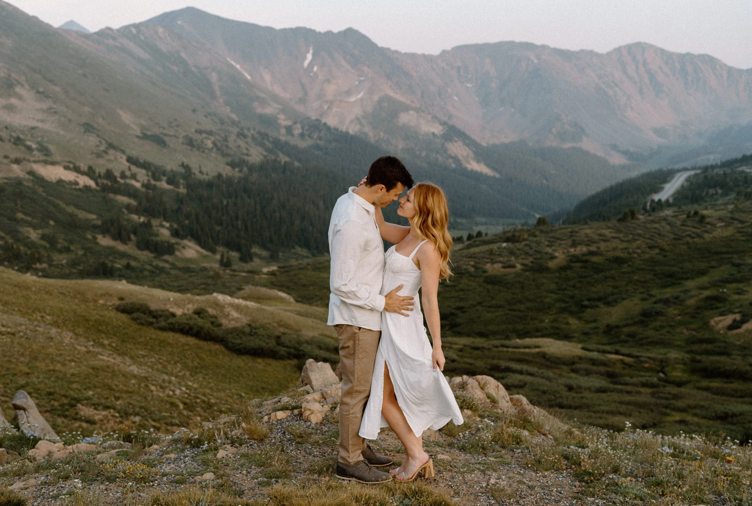 Couple touching foreheads during an engagement session at Loveland Pass