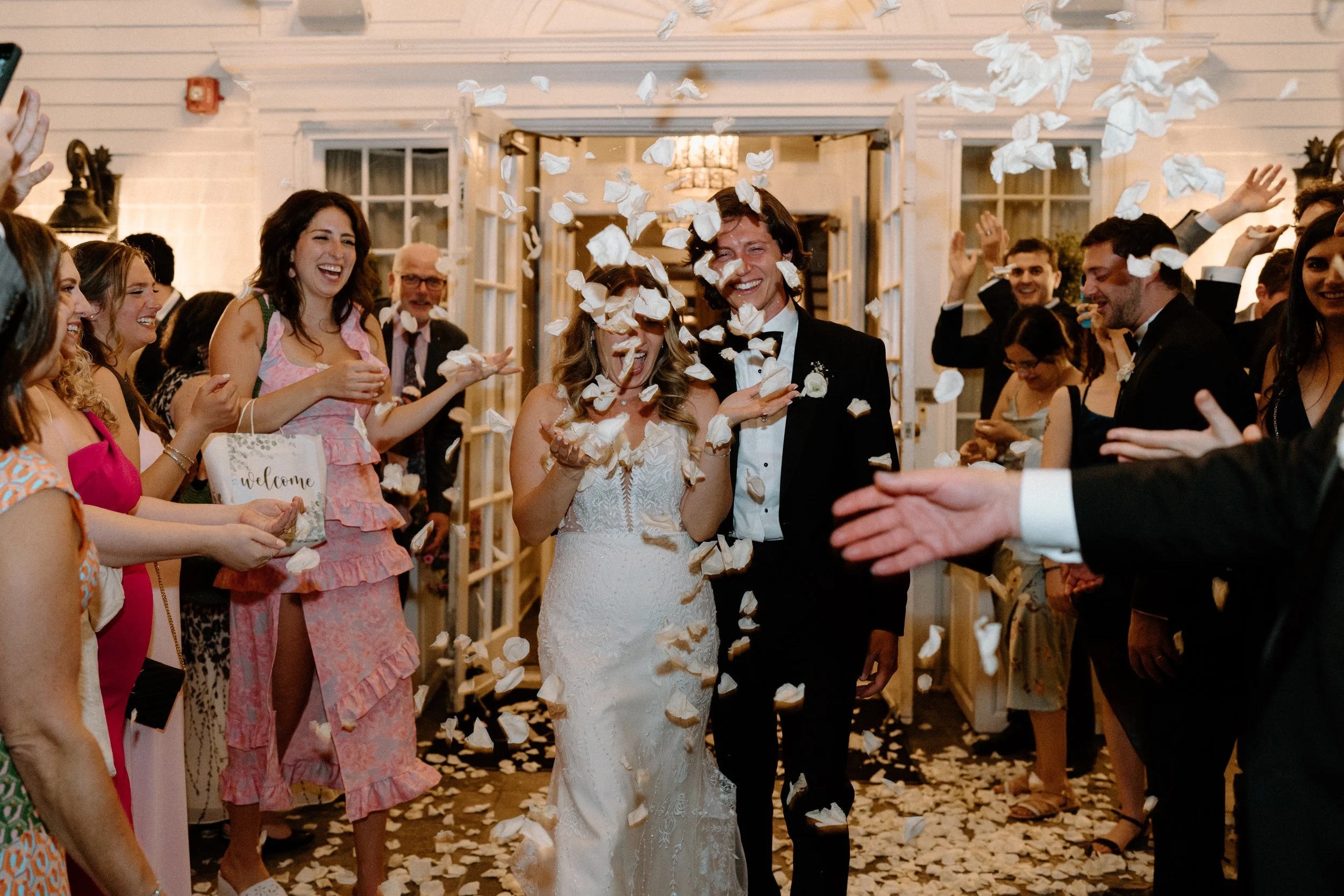 Bride and groom leaving The Manor House after wedding