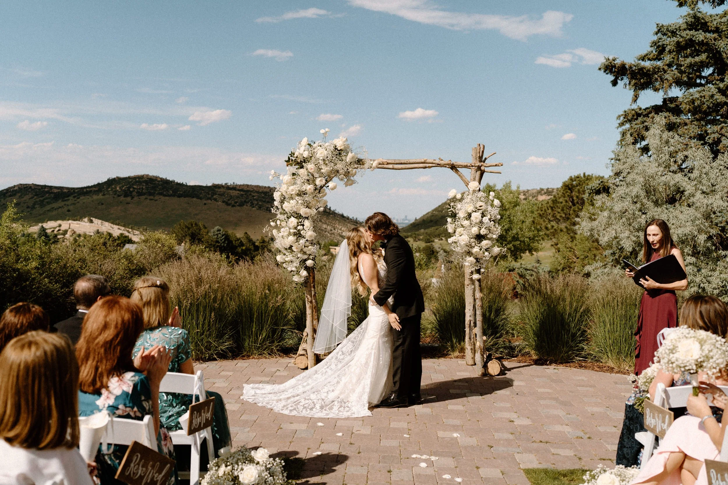 Bride and groom kissing during ceremony on wedding day at The Manor House
