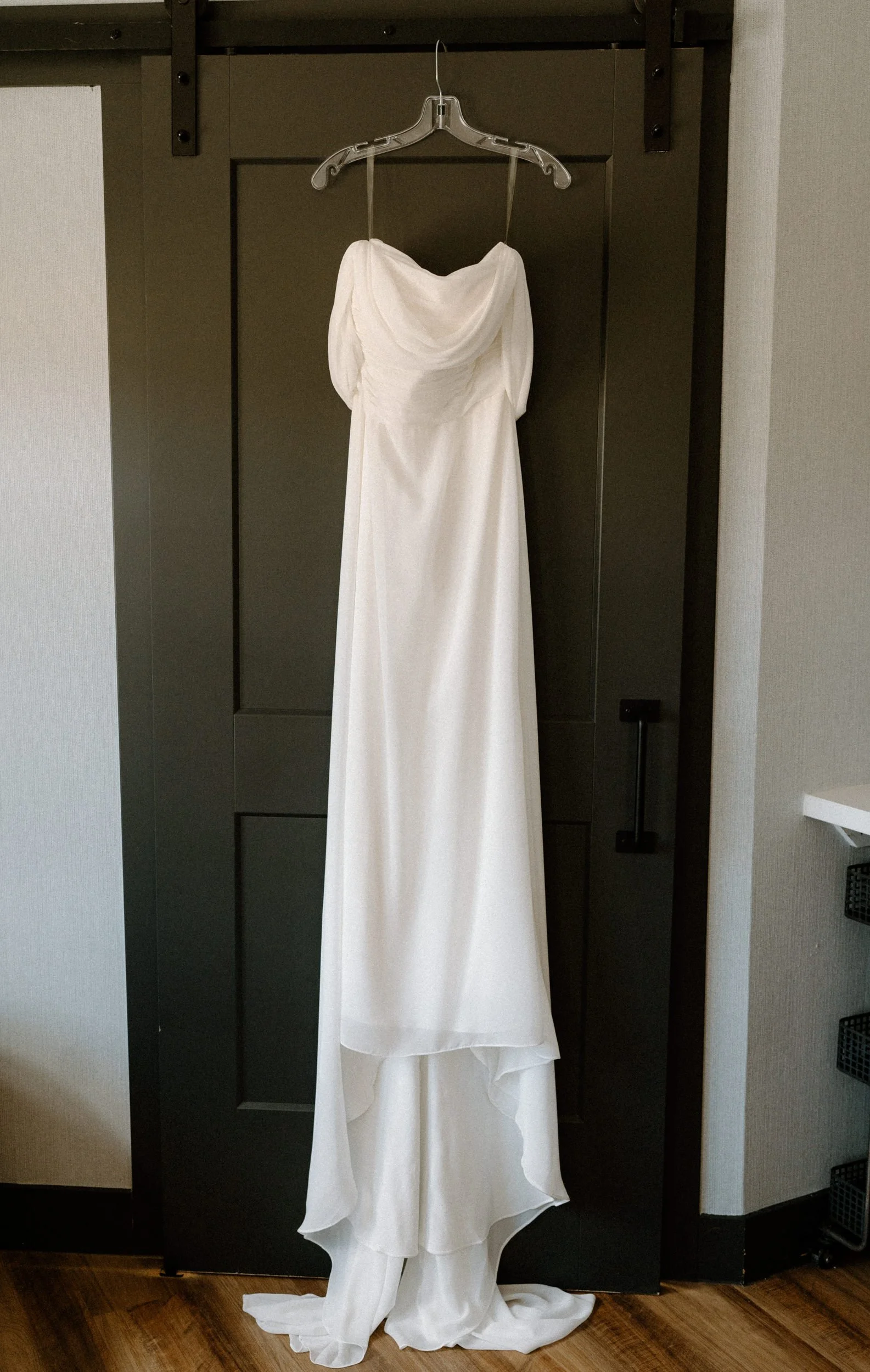 Wedding dress hanging on the door at The Eddy in Golden Colorado