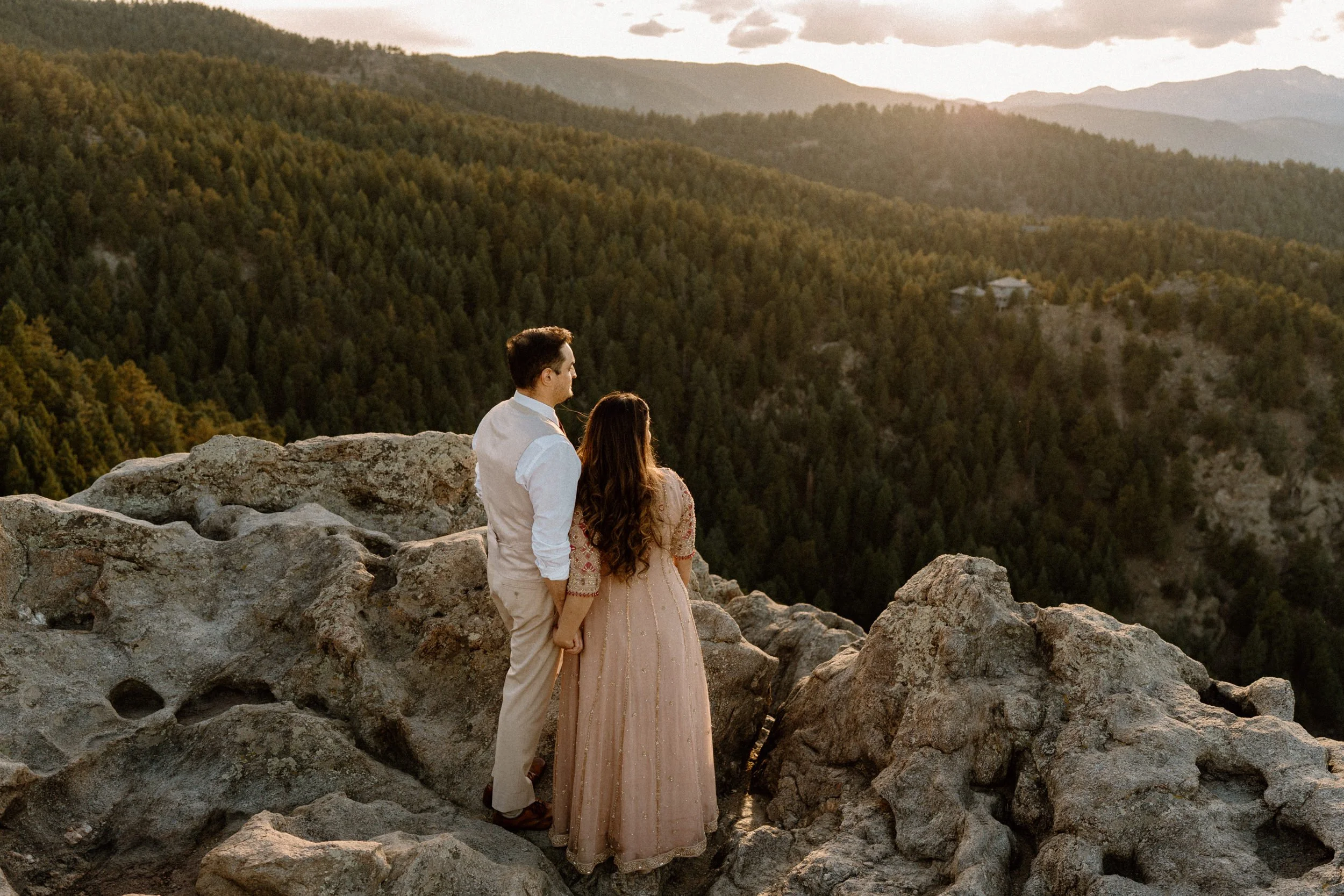 Couple admiring the view of the mountains in Boulder Colorado during an engagement session