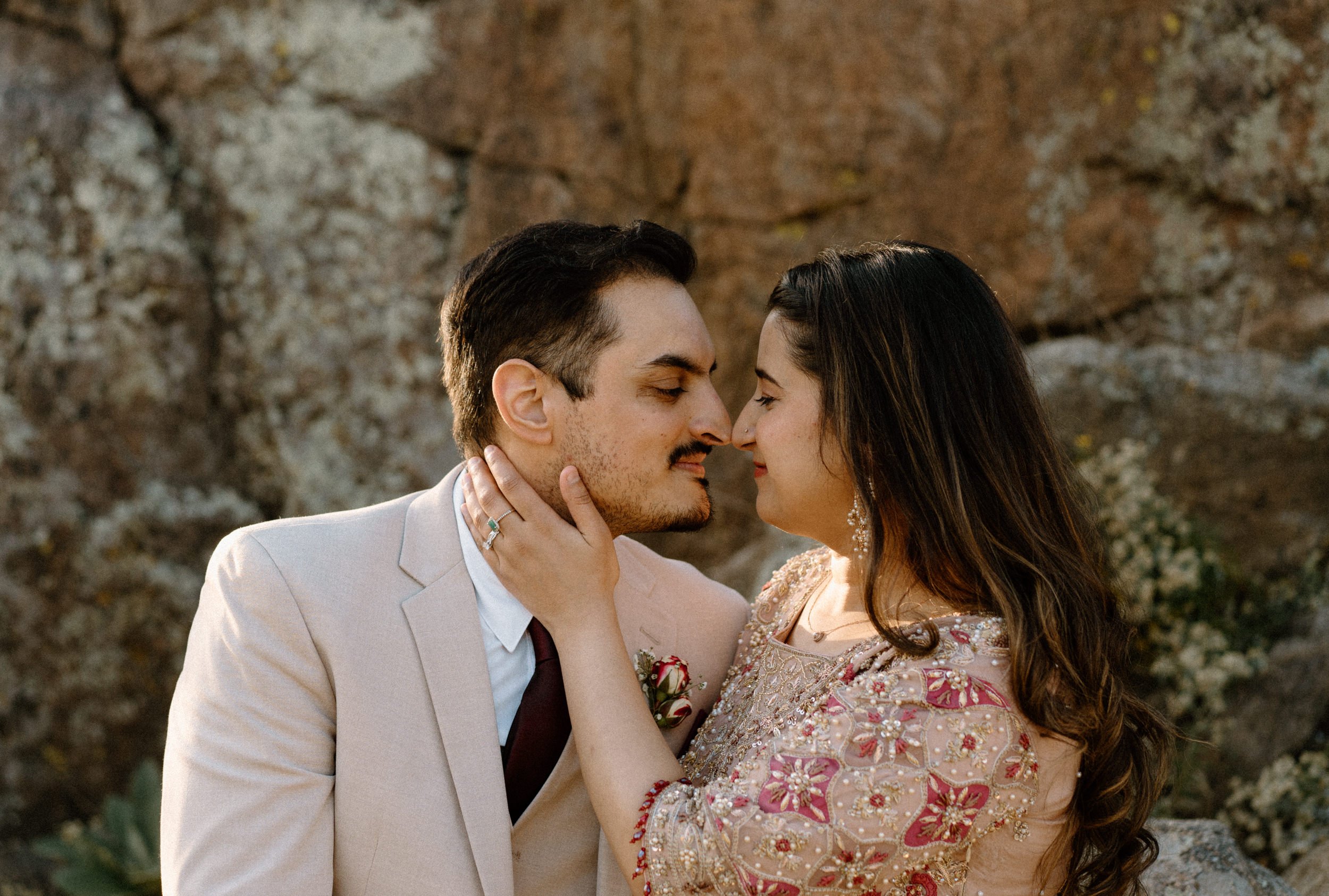 Couple smiling at each other during an engagement session in Boulder Colorado