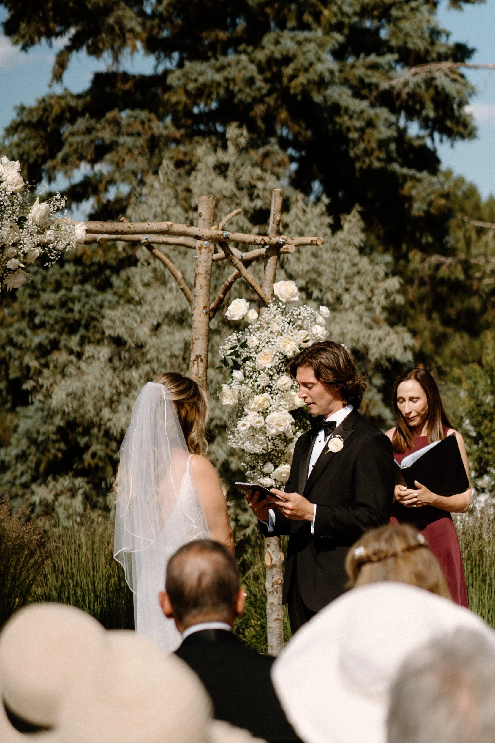 Groom reading vows during ceremony at The Manor House