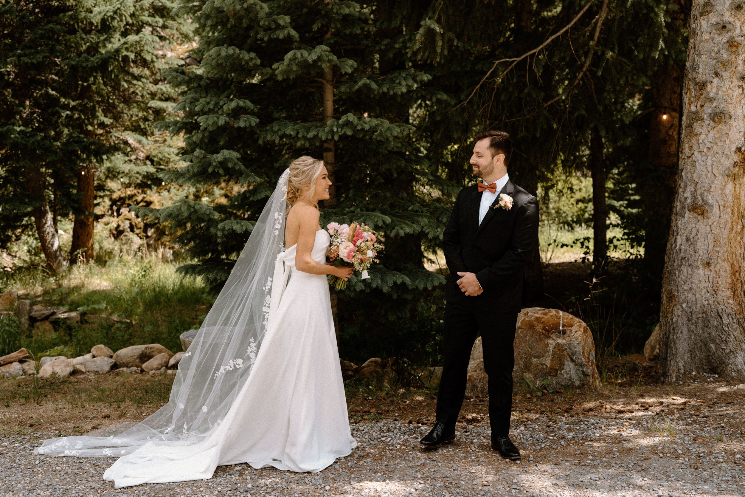 Groom turning around during first look on wedding day at Blackstone Rivers Ranch