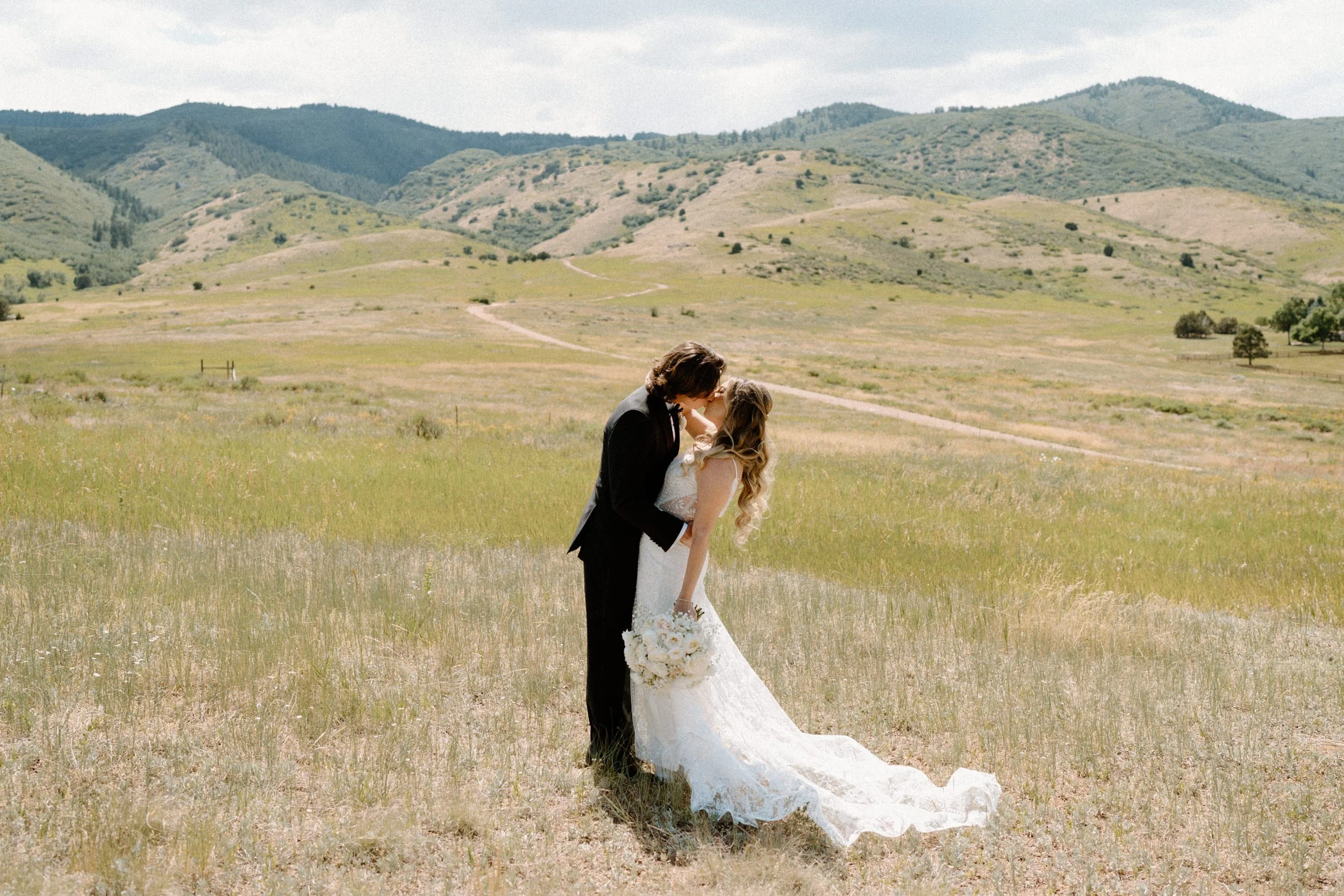 Bride and groom kissing during first look on wedding day at The Manor House