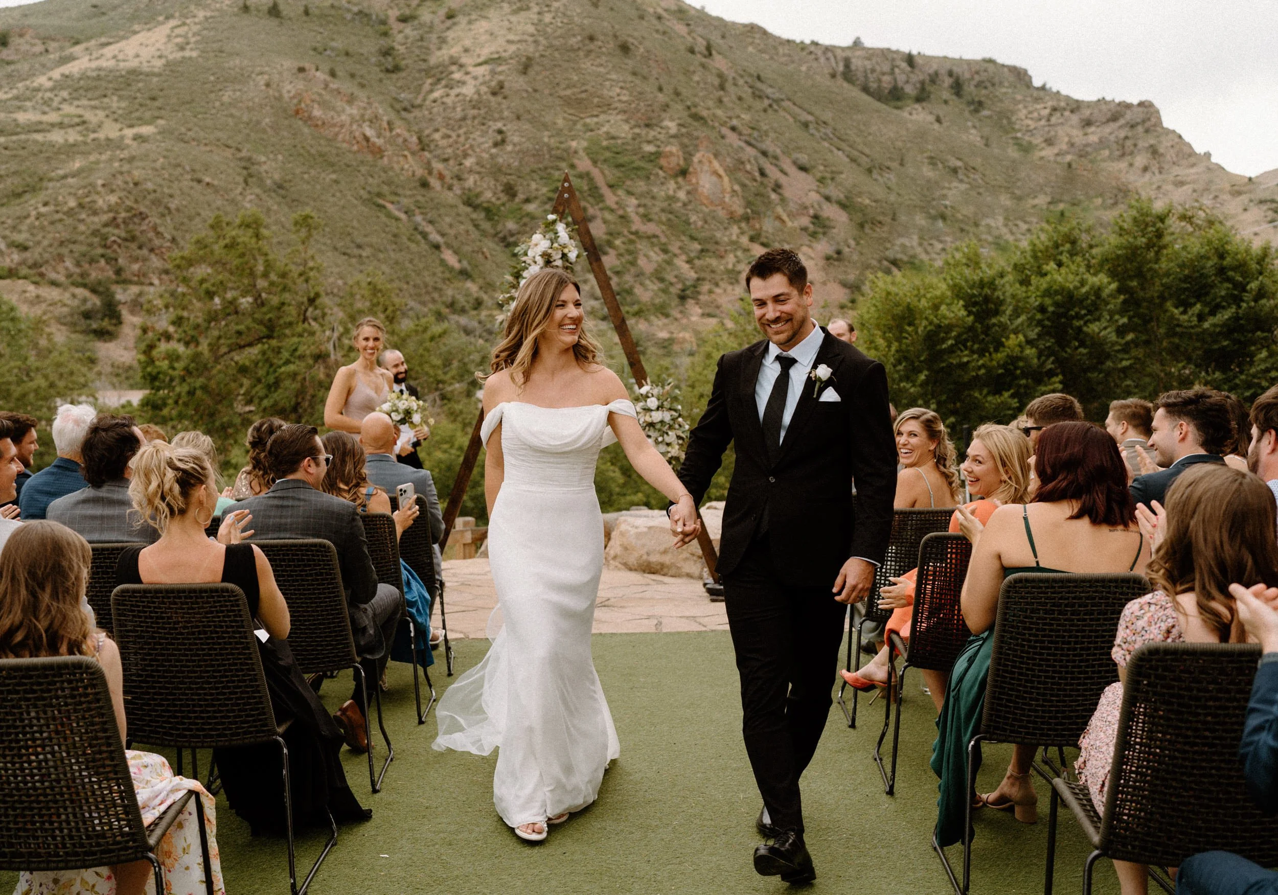 Bride and groom walking down the aisle after ceremony on wedding day at The Eddy in Golden Colorado