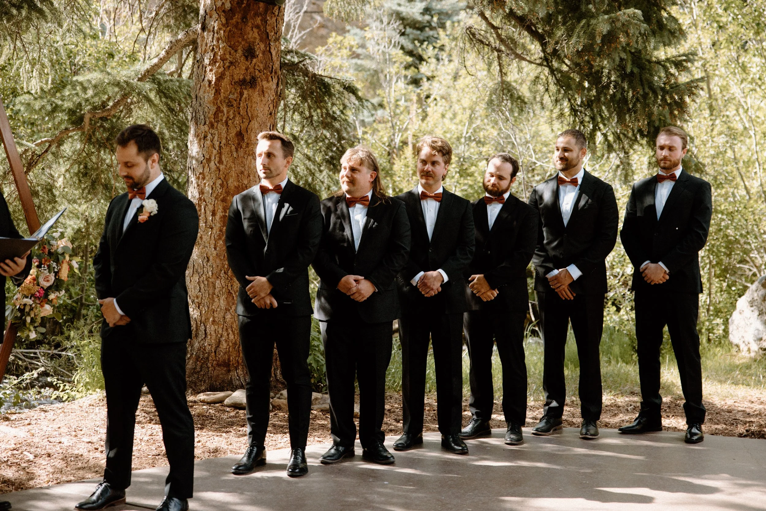 Groom and groomsmen standing at the alter on wedding day at Blackstone Rivers Ranch