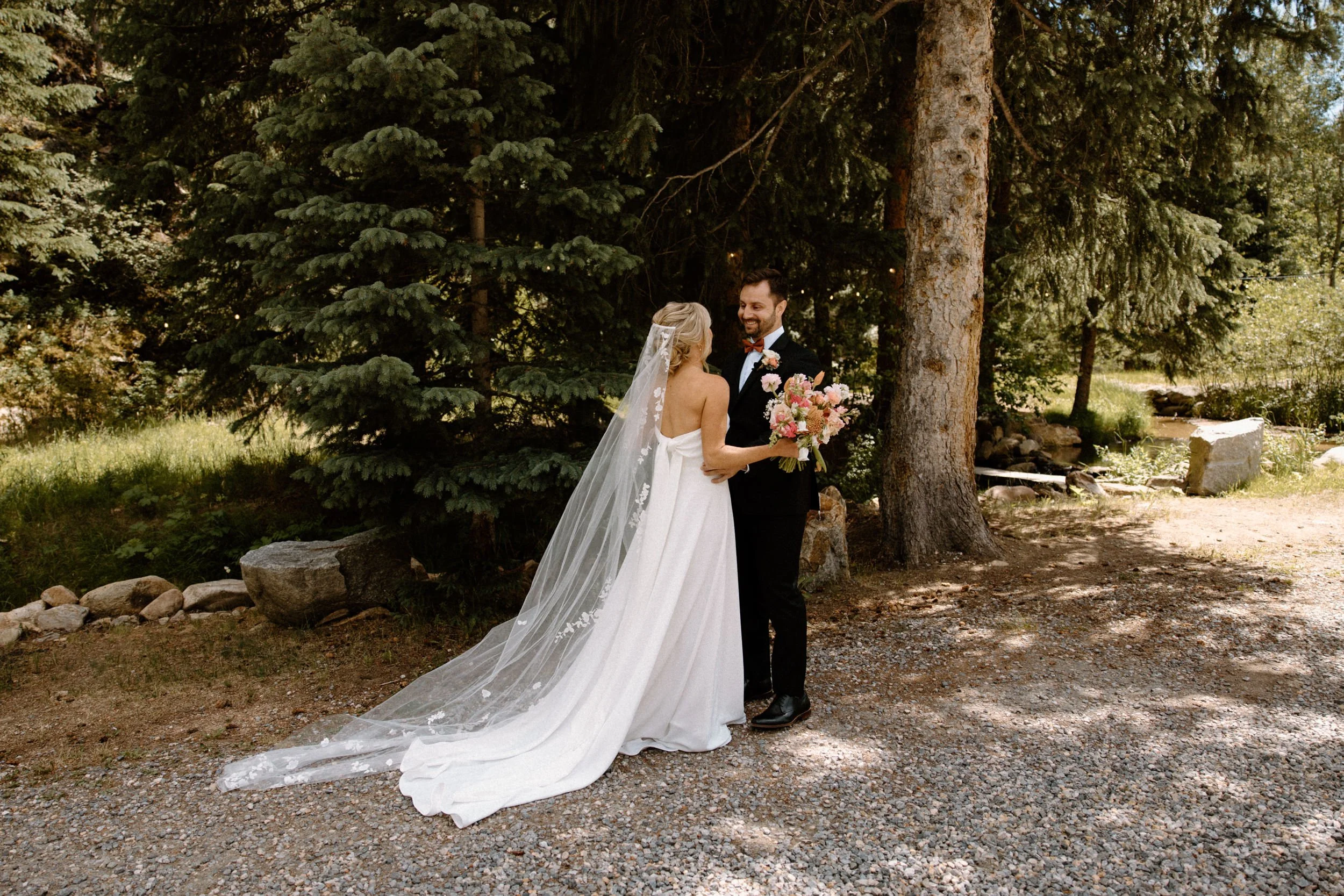 Groom smiling during first look on wedding day at Blackstone Rivers Ranch