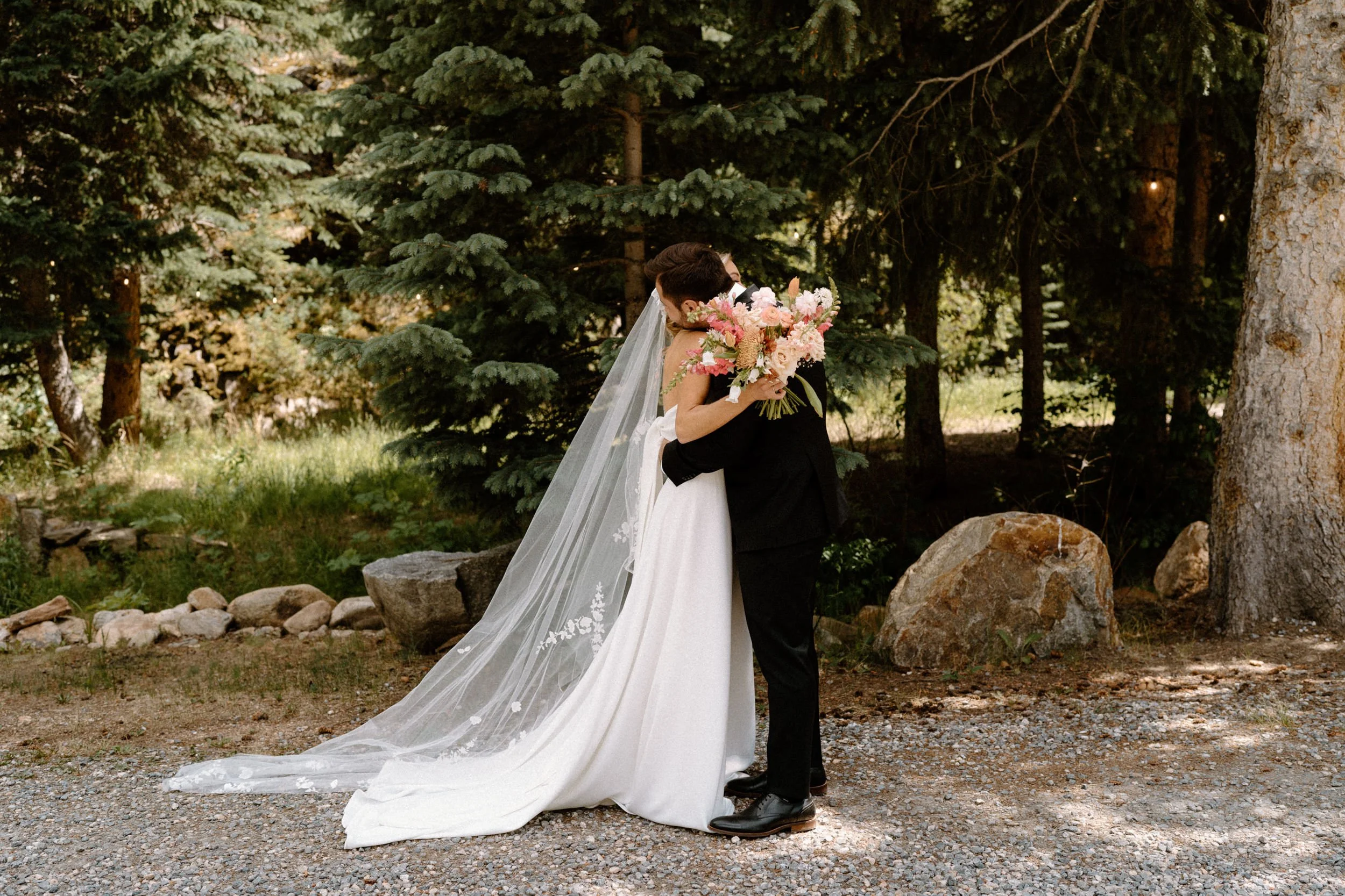 Bride and groom hugging during first look on wedding day at Blackstone Rivers Ranch