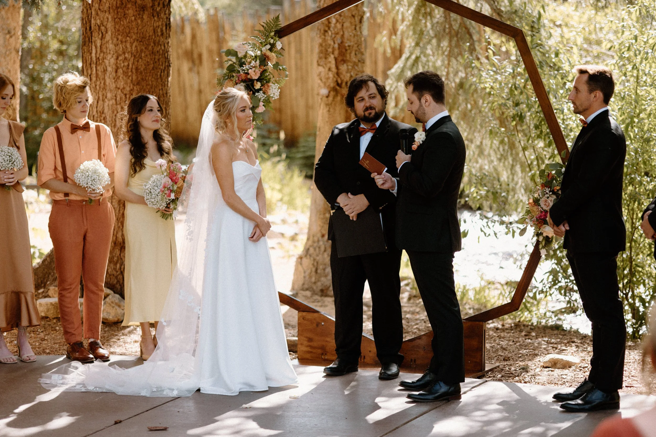 Groom reading vows during ceremony on wedding day at Blackstone Rivers Ranch