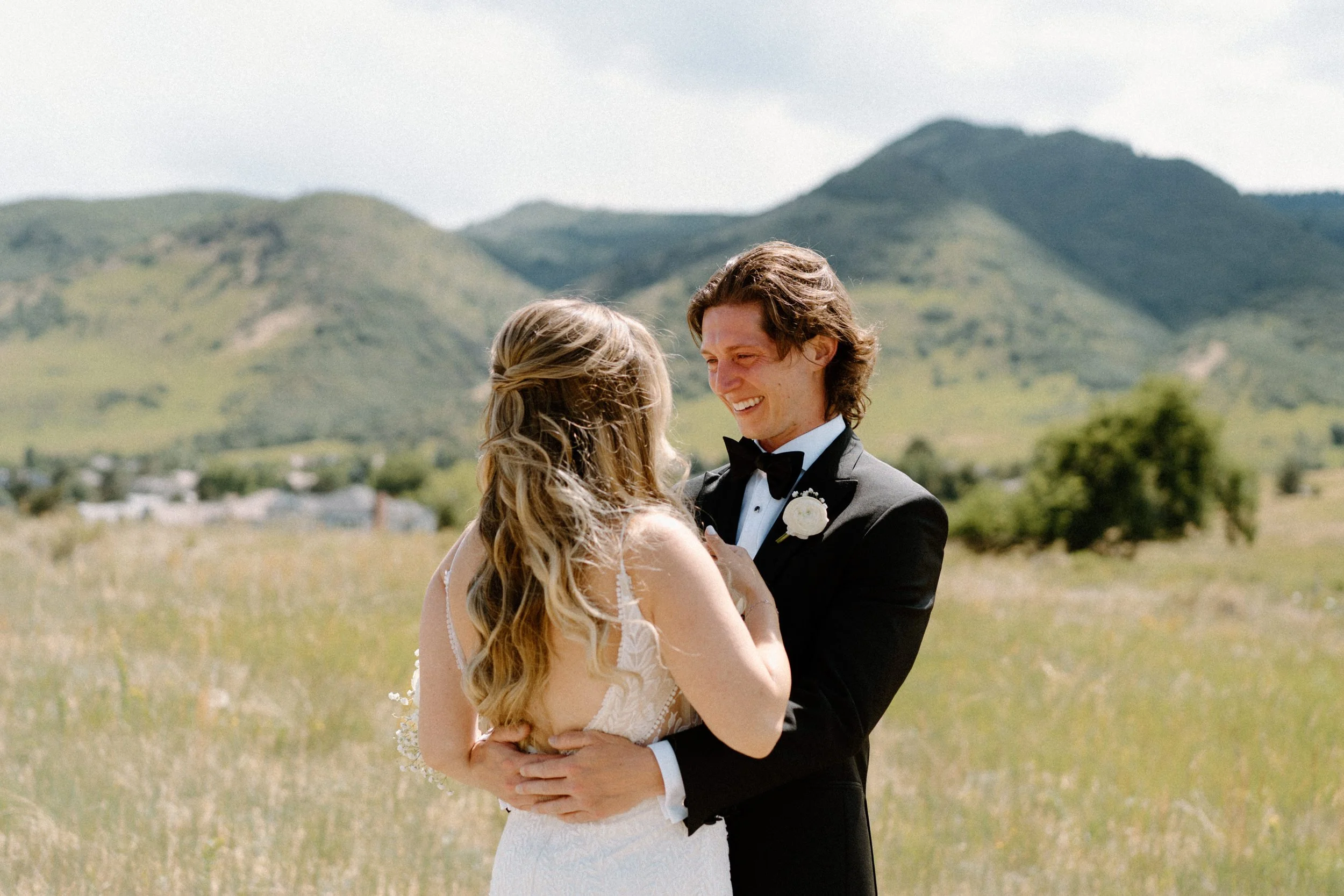 Groom smiling during first look on wedding day at The Manor House