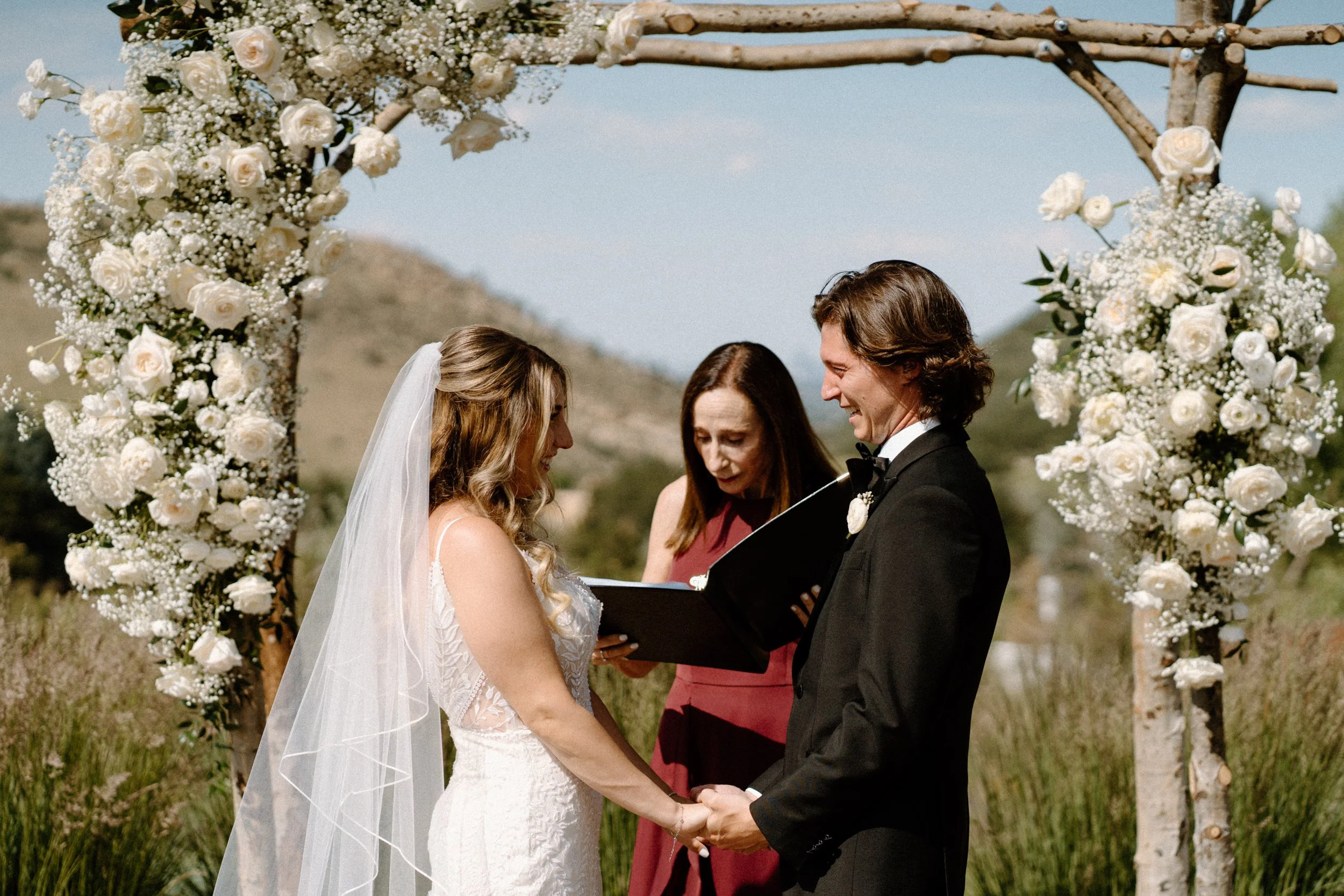 Bride and groom laughing during the ceremony on wedding day at The Manor House