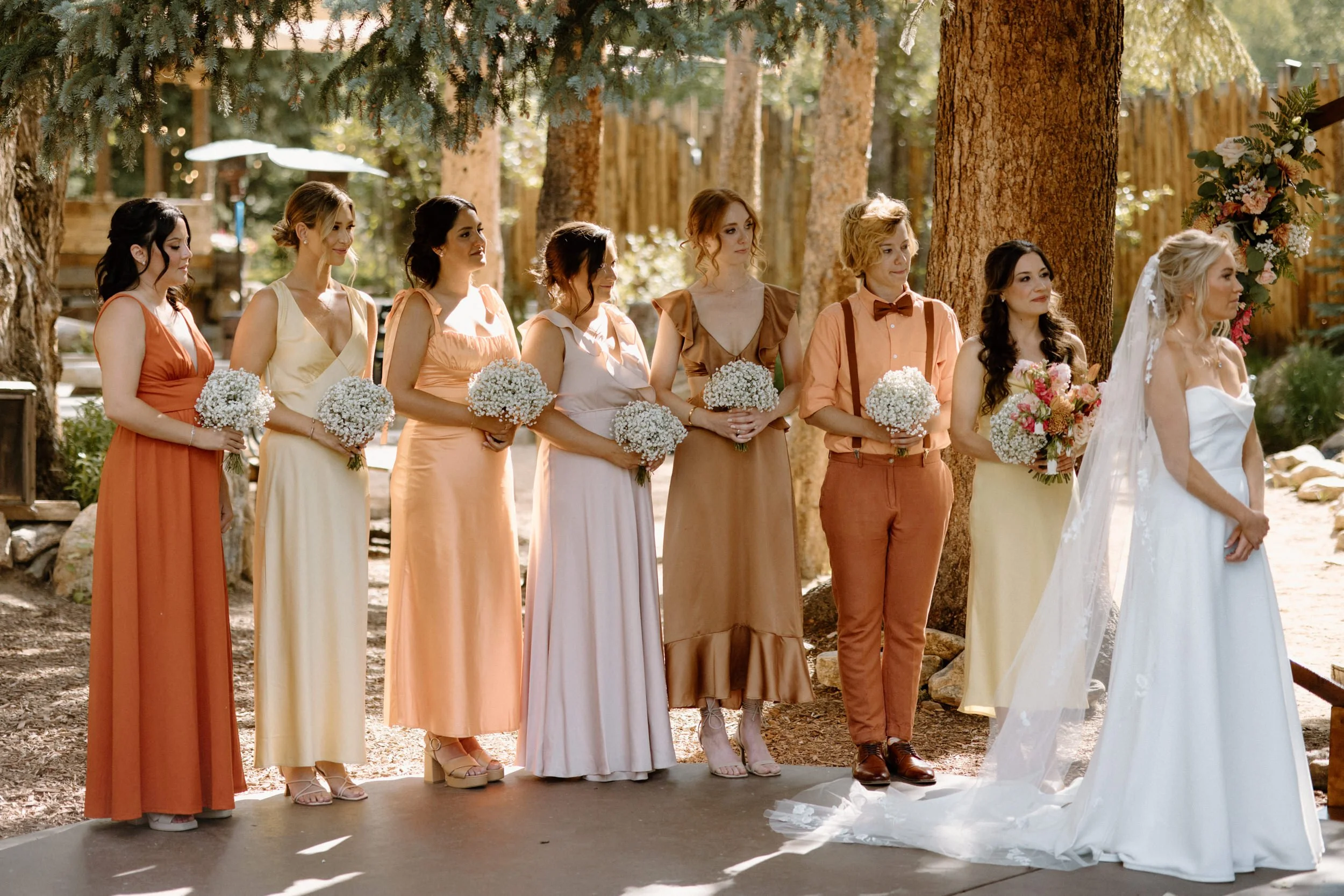 Bride and bridesmaids standing during ceremony on wedding day at Blackstone Rivers Ranch