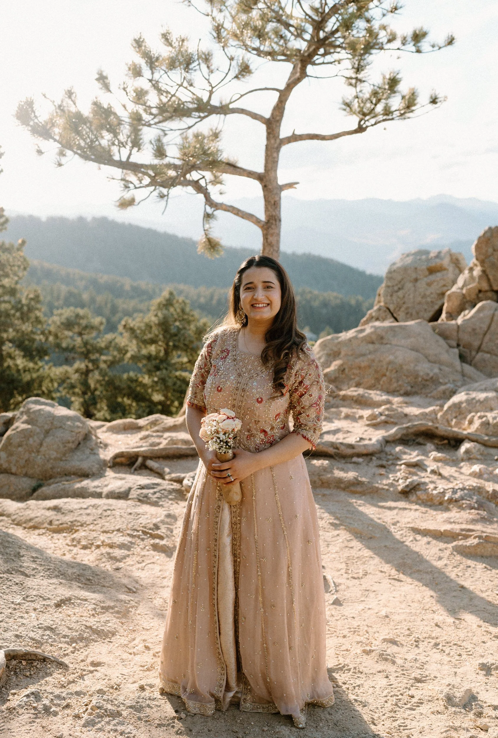 Fiancée smiling at the camera during an engagement session in Boulder Colorado