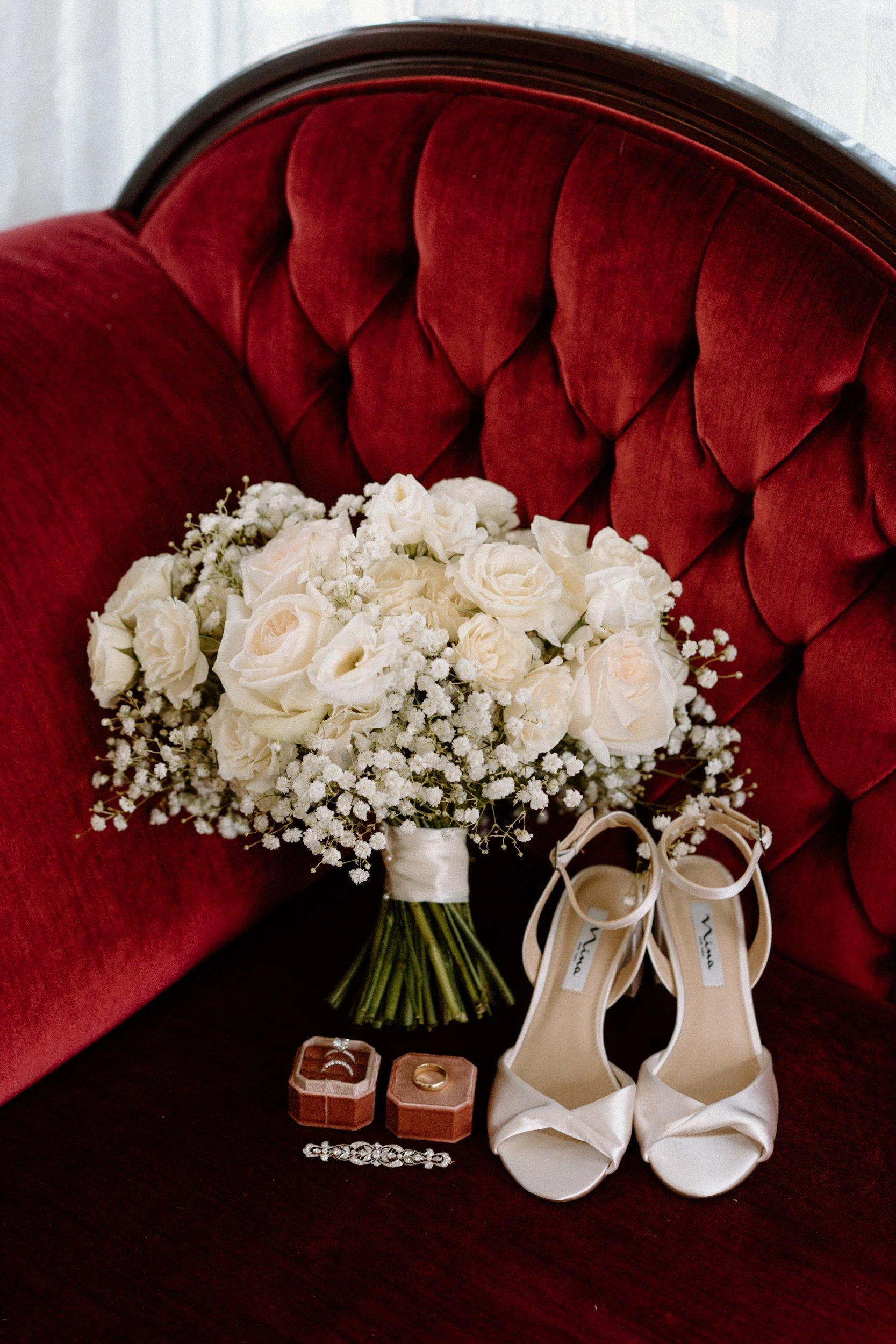 Bride's shoes, bouquet, and rings from a wedding at The Manor House