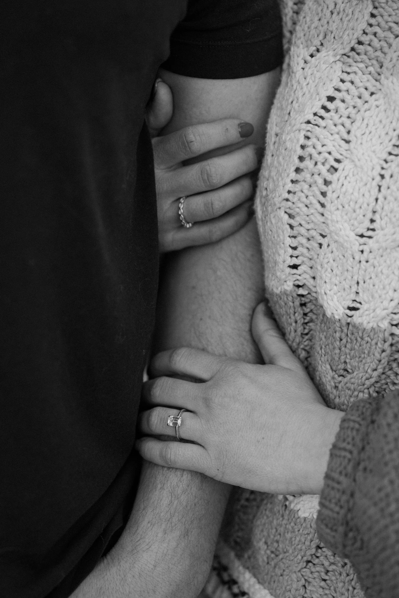 Couple's arms showing engagement ring during a session at Red Rocks