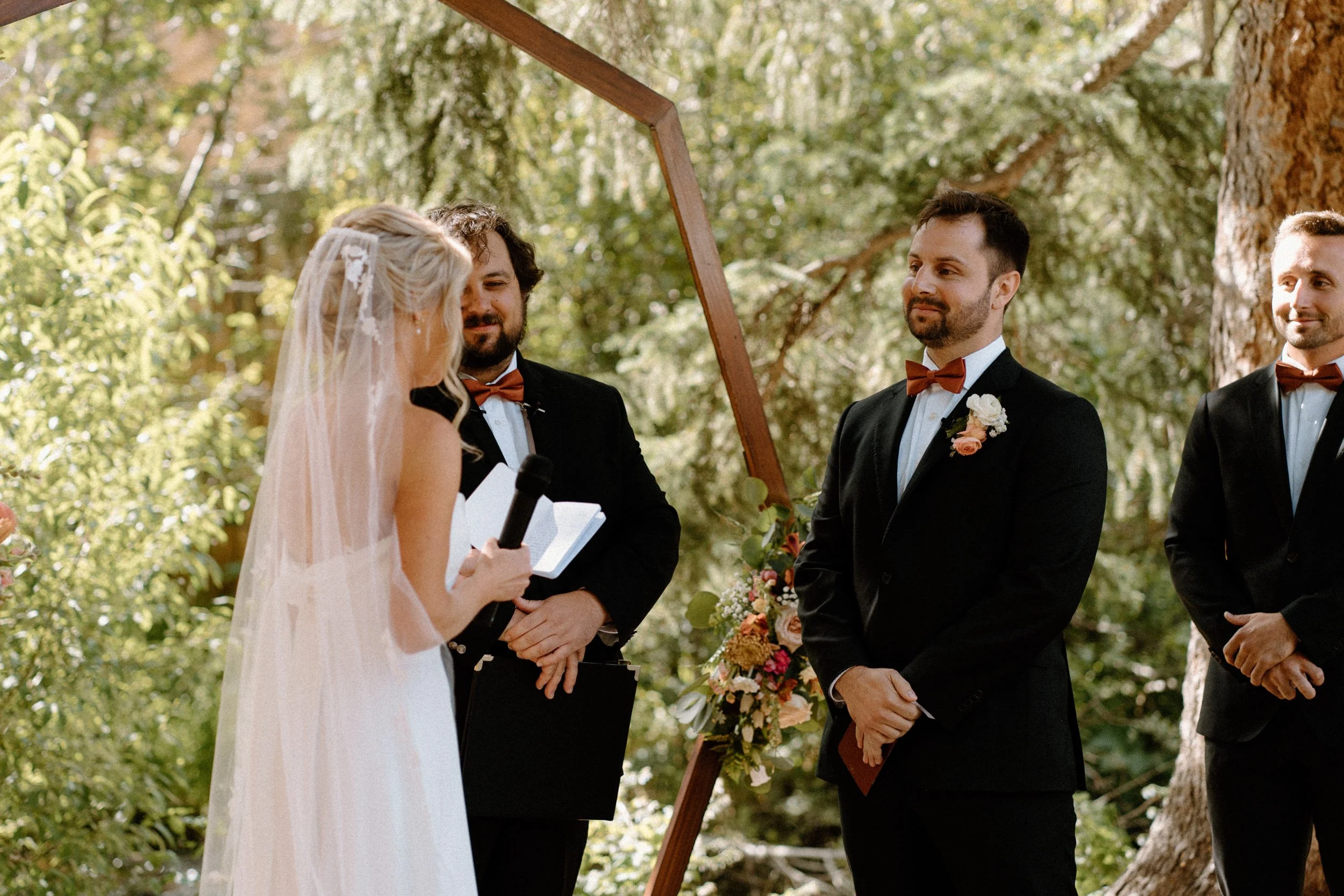 Bride reading vows during ceremony on wedding day at Blackstone Rivers Ranch