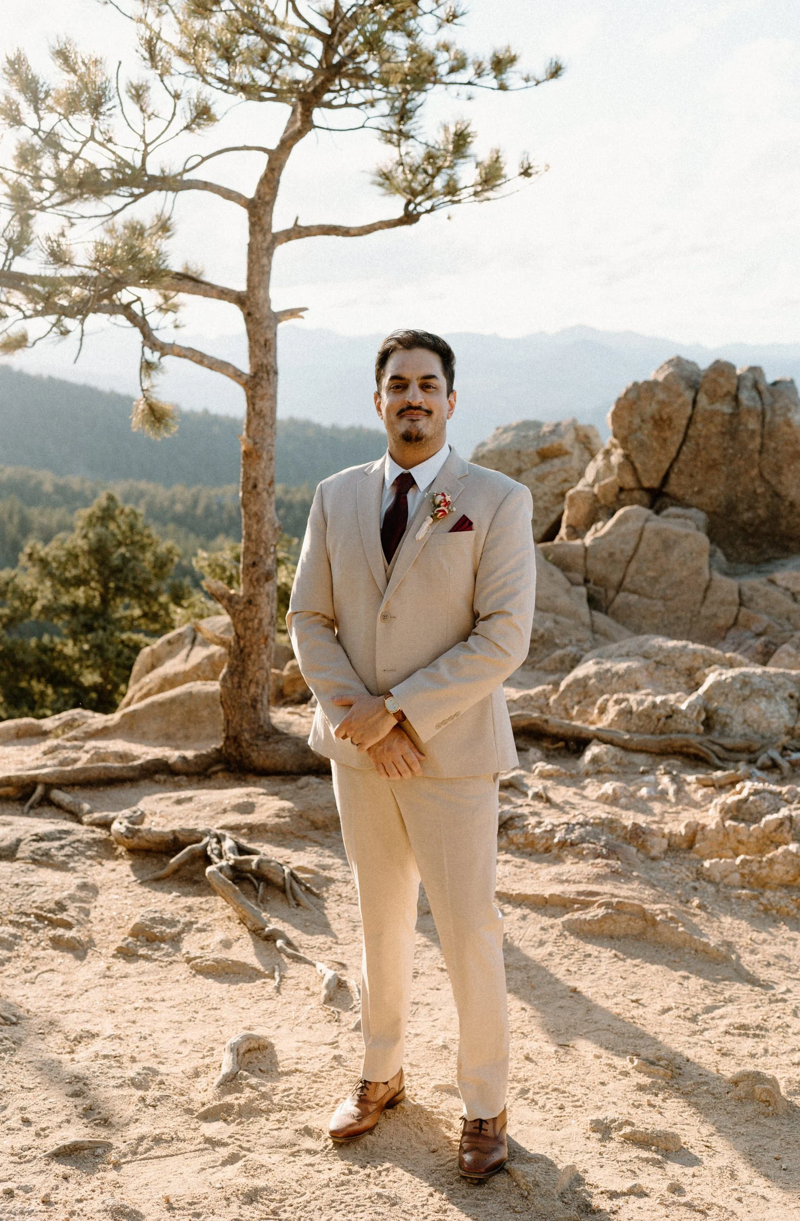 Fiance smiling at camera during an engagement session in Boulder Colorado