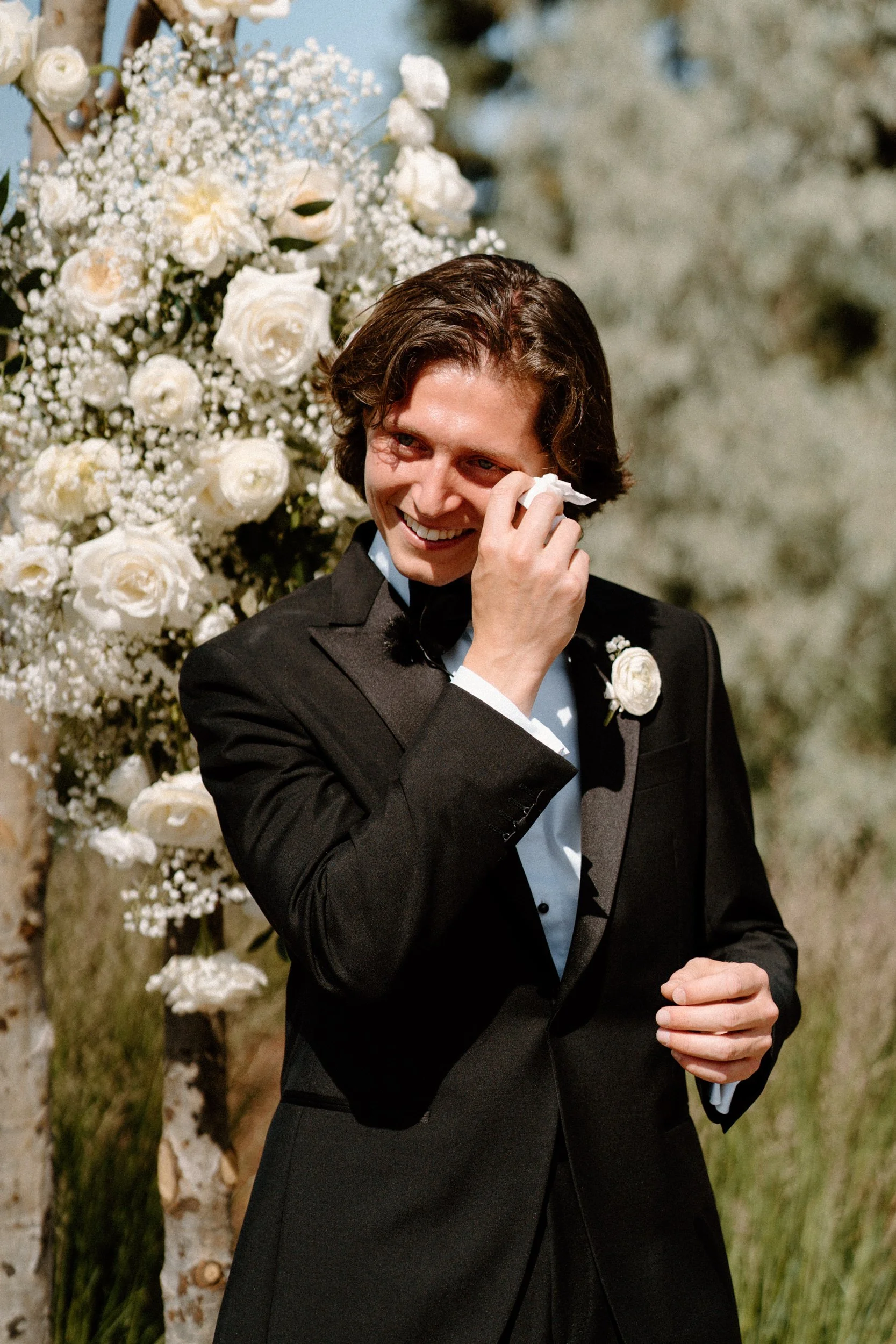 Groom crying as bride walks down the aisle on wedding day at The Manor House