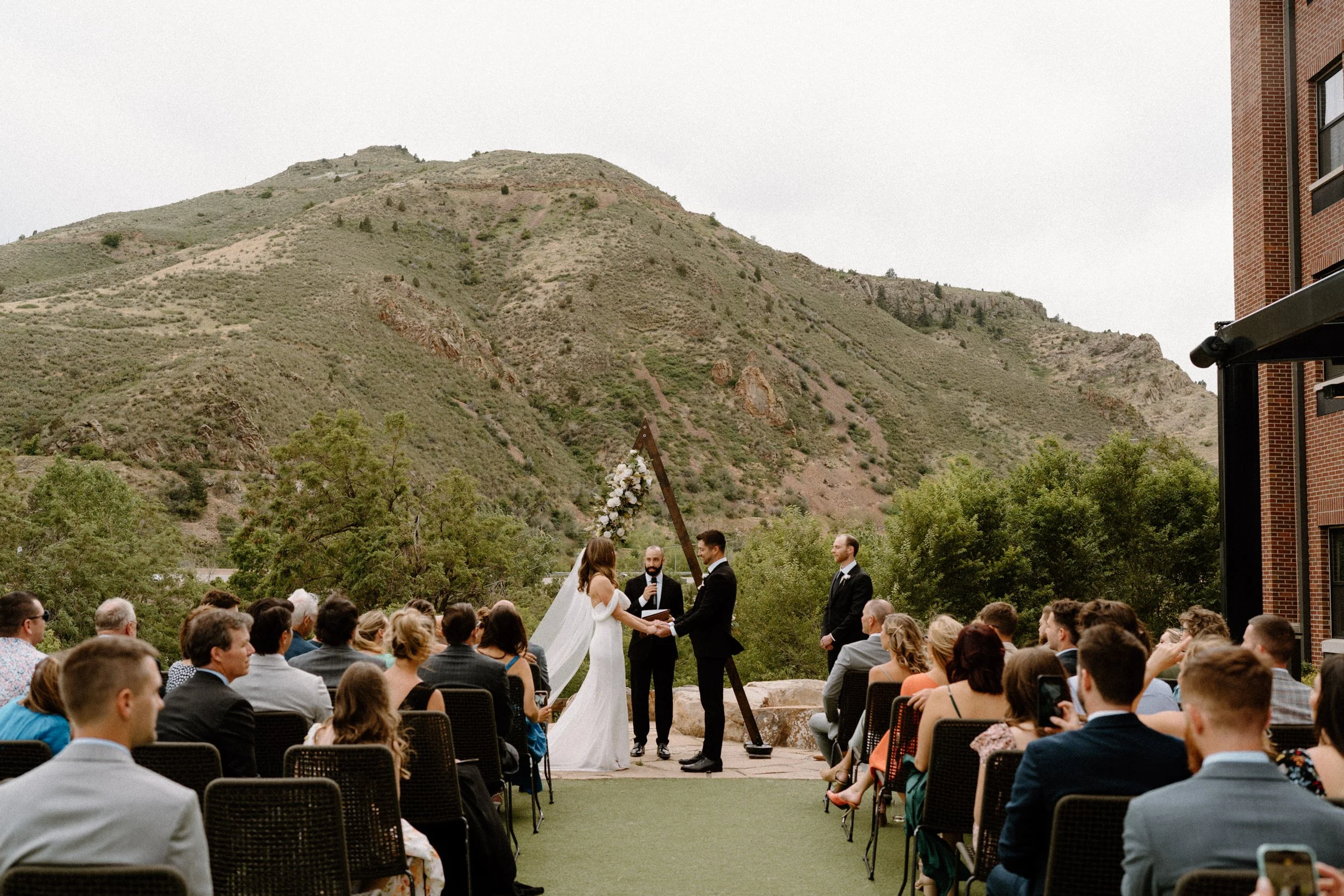 Bride and groom standing at the alter on wedding day at The Eddy in Golden Colorado