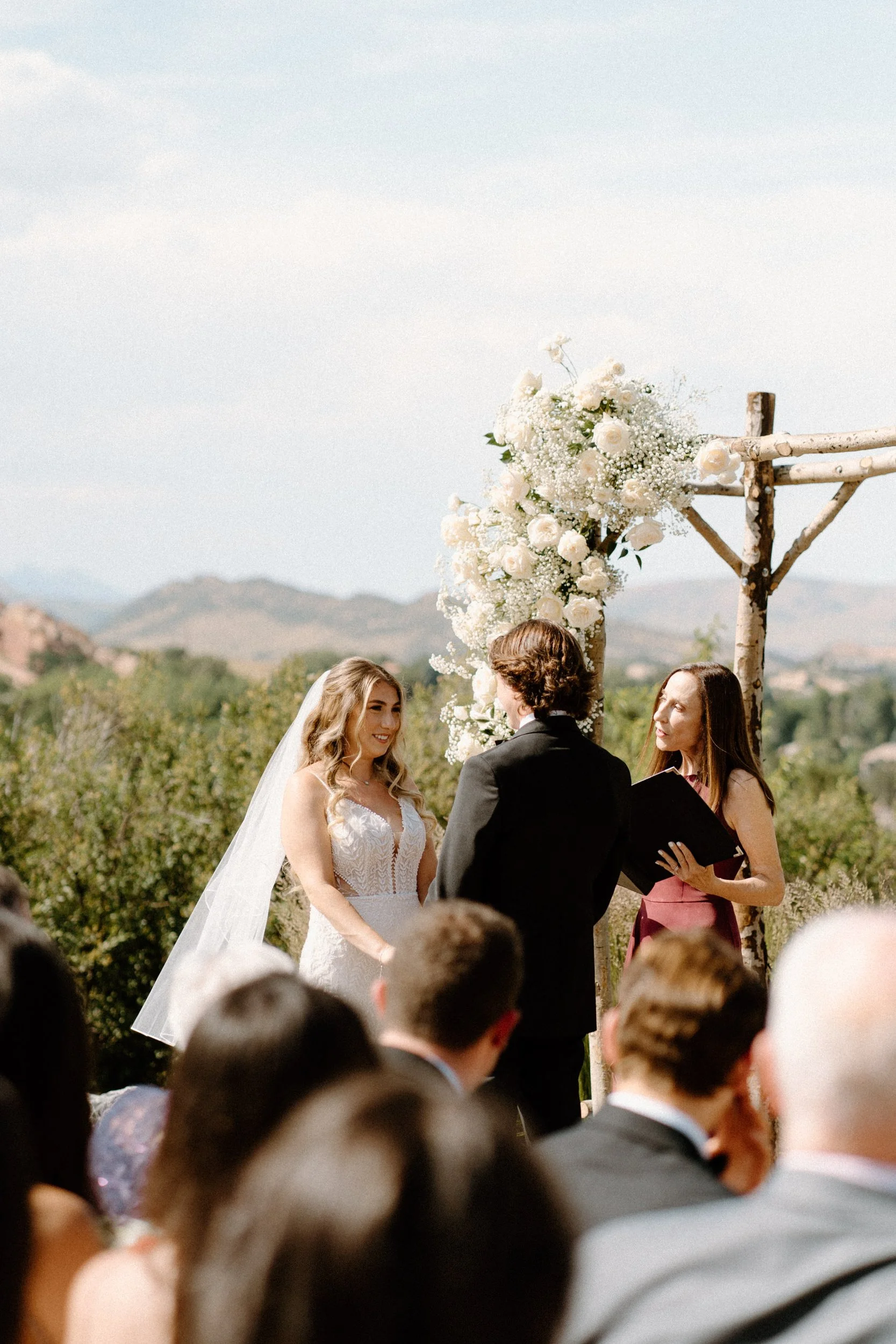 Bride smiling at the alter on wedding day at The Manor House