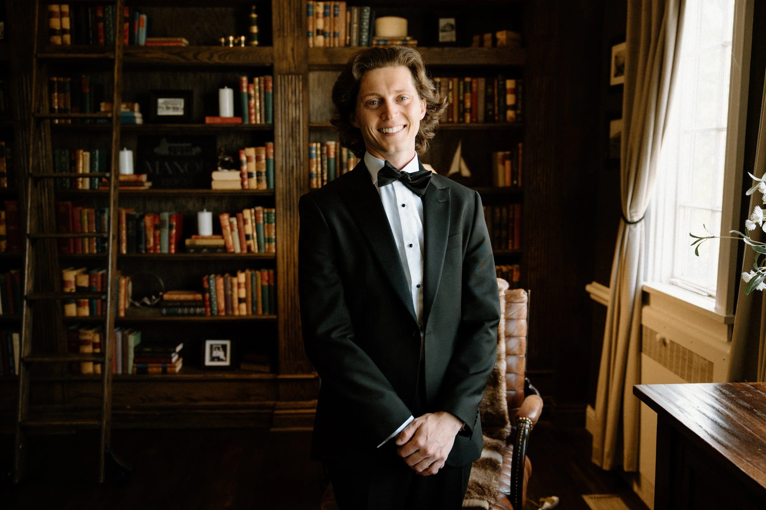 Groom smiling at the camera on wedding day at The Manor House