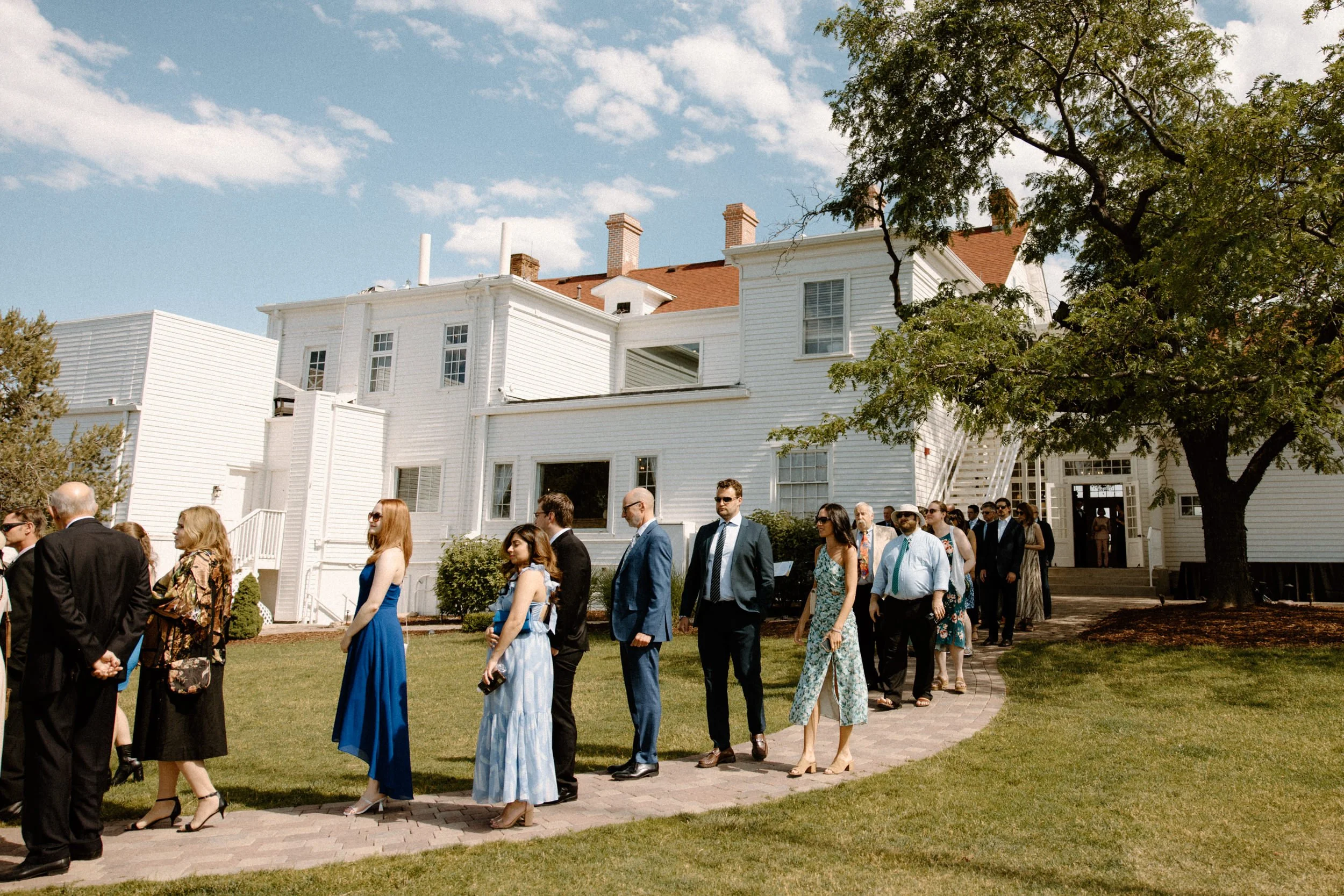 Wedding guests walking into ceremony on wedding day at The Manor House