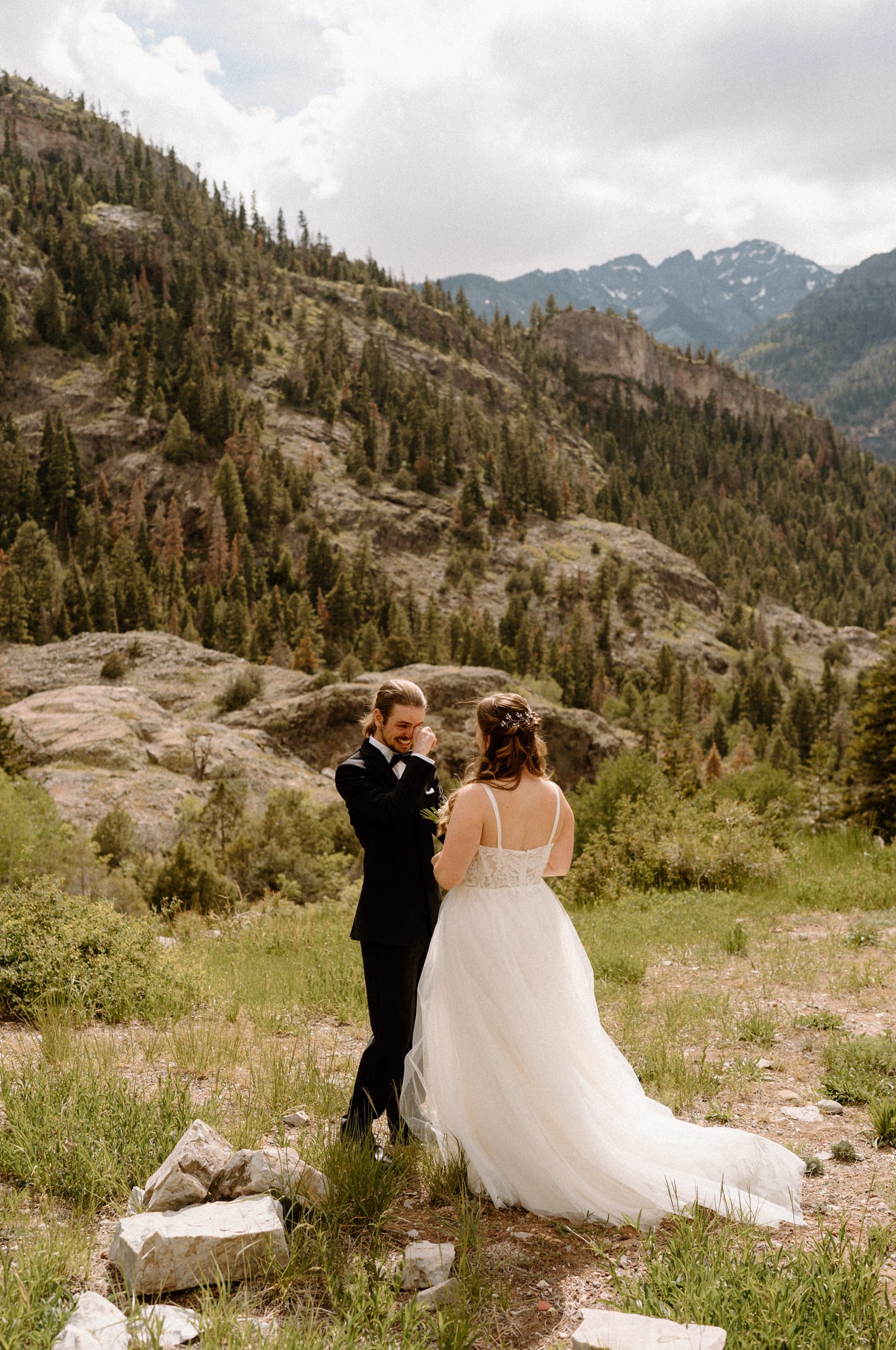 Groom crying and smiling during an elopement in Ouray Colorado