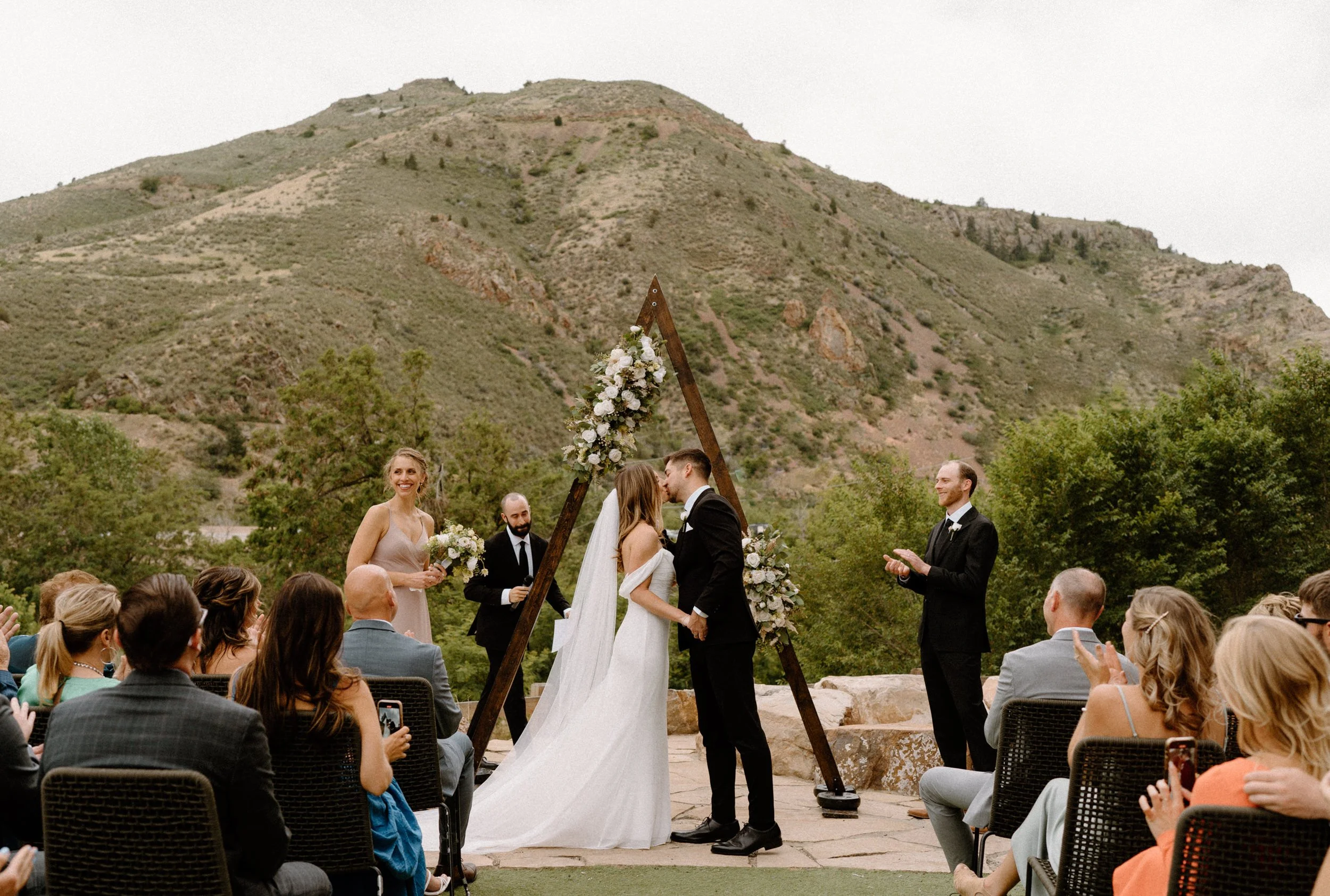 Bride and groom kissing at the alter on wedding day at The Eddy in Golden Colorado